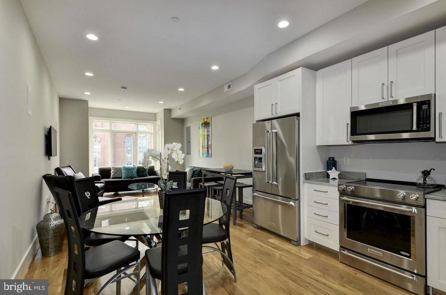 Lifestyle, Luxury and Location. Beautiful 3 bdrm 3 bath penthouse in Logan Cir/Shaw, offers an open floor plan flooded with natural light, ideal for both living and entertaining. Featuring Hrdwd flrs, Gourmet kit, luxury baths, master suite w/ walk in closet, Washer/Dryer, cable wired/ surround sound speakers, top floor Wet bar w/ Rooftop deck.