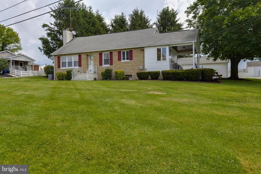 Add this to your list of homes to see, you'll be surprised.  Stunning view on 1+ acres. Multiple updates: HW floors, kitchen, bath, SS chimney liner, new hot water heater, well pump 2 yrs new. Main level MBR & laundry. Wood-burning furnace provides 2nd heat source.  2-car det. garage, workshop w/ 220 electric & wood stove, shed & addt'l large bldg.  HMS home warranty transfers to buyer.