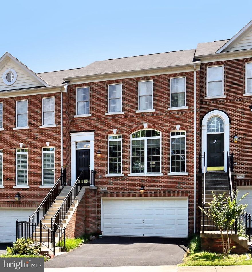 Welcome to 4111 Quiet Crossing Court in beautiful Fairfax, Virginia! Nestled in the sought-after Stone Creek Crossing community where pride of ownership clearly shows, this lovely townhome is infused with countless designer finishes. A modern exterior, 2-car garage, an open floor plan, and a gourmet kitchen are only some of the fine features that make this 3 bedroom, 3.5 bath townhome so special. An abundance of windows, 9  ceilings, and natural materials bring the best of the outdoors inside, while an on trend color palette and fine craftsmanship create instant move-in appeal.Warm hardwood flooring welcomes you home as you are ushered upstairs and into the spacious living room highlighted by a wall of windows streaming natural light. The dining area offers plenty of space for formal occasions, as an Edison light fusion chandelier adds a distinctly refined flair. The open gourmet kitchen stirs the senses with 42  cabinetry, gleaming granite countertops, and includes a gas cooktop and French door refrigerator. Decorative backsplashes add warmth to the space and recessed lighting provides ample light. The adjoining family room harbors a cozy gas fireplace, as a powder room with pedestal sink complements the main level.Upstairs, the light-filled owner s suite boasts a soaring cathedral ceiling, walk-in closet, and an en suite bath featuring a dual-sink vanity, sumptuous soaking tub, glass-enclosed shower, and spa-toned tile. Down the hall, two additional bright and cheerful bedrooms, each with vaulted ceilings and generous closet space, share access to the beautifully appointed hall bath. Fine craftsmanship continues in the walkout lower level recreation room with an additional fireplace, brand new patio doors to the fenced-in yard, and a well-appointed full bath thus completing the comfort and luxury of this wonderful home.All of this is located in a pristine community at the heart of Fair Lakes. Commuters will appreciate its close proximity to I-66, Route 50, and the Fairfax County Parkway, and everyone will enjoy the diverse shopping and dining choices down the street in Fair Lakes, Fairfax Corner, and Fair Oaks Mall, plus Whole Foods, banking, and Starbucks all just a short drive away. If you are looking for a fabulous home filled with natural light and quality upgrades in a vibrant community, this is it. Welcome home!