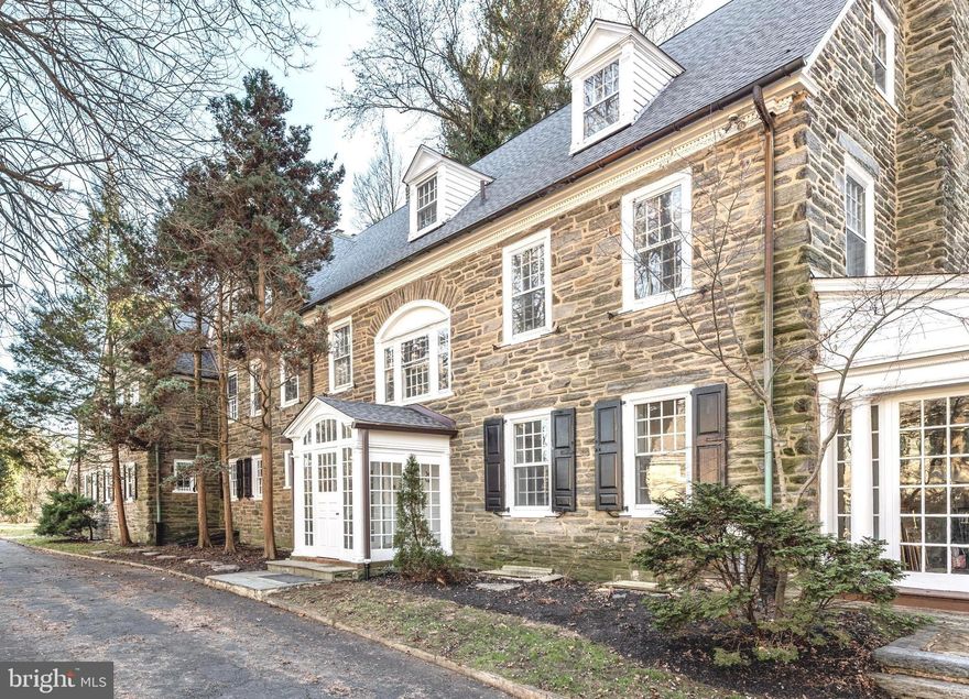 Welcome to 434 W. Allens Lane, a gorgeous colonial stone estate, lovingly maintained by the present owners and available for the first time in almost 35 years. Enter through the glass vestibule into the grand dual entry foyer with walnut colored hardwood floors and panel & crown molding. The stately Living Room features a wood-burning fireplace with wooden mantle & marble surround flanked by French doors leading to a magnificent enclosed sun porch with wood burning fireplace. An arched doorway and oversized hall lead to the formal Dining Room featuring a wood burning fireplace with wood paneled walls and a rustic beamed ceiling that perfectly balances the formality of the space. The updated Kitchen boasts granite countertops, center island for additional seating, and white cabinetry with crown molding & glass doors for displaying treasured items. The architectural interest of this home continues through the exquisitely detailed arched doorways to the built-in shelves in the den/library. A perfect place to read, unwind, or simply enjoy some peace and quiet by the fire. Take the elevator or head up the impressive u-shaped staircase with a bright, sunlit landing to find 5 Bedrooms, each with old-world charm and details that have stood the test of time. There is a fireplace in the sitting room off the Primary Suite as well as in the office. 3 Full Baths and a Half Bath complete this level. Another flight up leads to 3 Bedrooms, one with a fireplace, and 2 Full Baths. This home is situated on beautiful grounds with mature landscaping and has a detached garage with potential to create an incredible outdoor space to entertain in the warmer months. Located in the heart of W. Mt. Airy, and close to local favorites such as Allens Lane Art Center, Weaver’s Way Co-Op, and Walnut Lane Golf Club. Chestnut Hill, the trails of the Wissahickon, and Fairmount Park, in addition to commuter trains and/or a short drive to Center City, this home offers the best of both worlds. You do not want to let this opportunity pass you by!