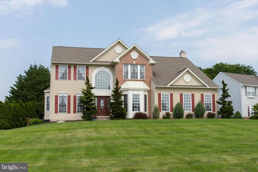 Spectacular home loaded with upgrades!  Soaring 2 story entrance with palladium window, hardwood flooring and turned staircase. Kitchen w/Cherry cabinetry, island/breakfast bar. Large sunken family rm w/fireplace. Luxurious owner's suite.  Finished lower level has a gym w/cork floor, home theater, stacked stone wall.. Rear yard is a sanctuary w/paver patio, pergola, koi pond and putting green.