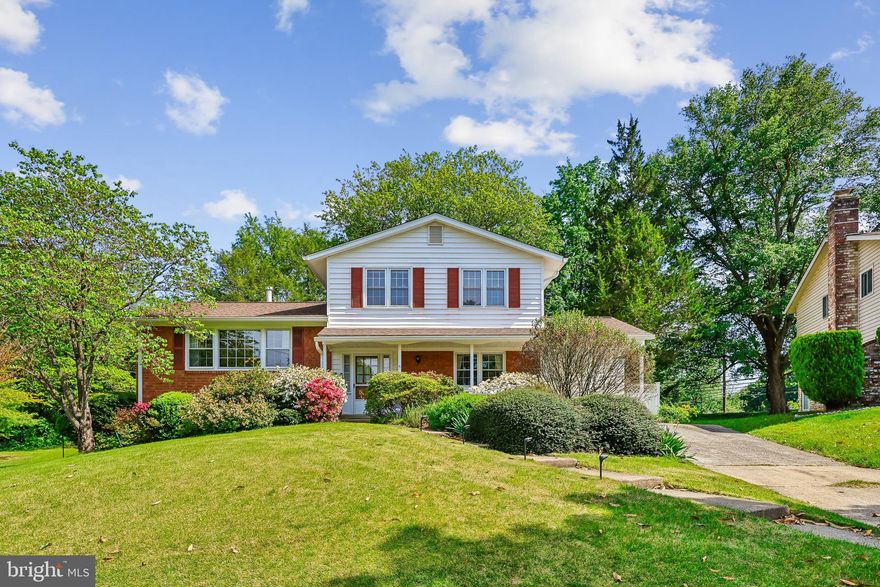 Discover the charm of this beautifully maintained split-level home nestled in the desirable Paint Branch Estates. This property offers ample outdoor space for gardening, entertaining, or simply enjoying the tranquility of nature; a perfect blend of comfort and functionality. Built in 1965, the property exudes a warm, inviting atmosphere, ideal for creating lasting memories. With shining wood floors and easy flow, entertaining is a joy. The wood burning fireplace, complete with tools, creates a delightful room for relaxation and a wall of windows to enjoy the spring blossoms and birds nesting. The wet bar is perfectly situated between the family room and kitchen to conveniently grab sodas and hard lemonades for your next family gathering. The formal dining room is large enough to put in all the leaves to your table! And extra space in the living room for the ‘kids’ table. With three spacious bedrooms and two full bathrooms on the upper level, this home accommodates daily routines with ease. Use the main floor bedroom [new carpet] as an office, den or guest room; the powder room is just across the hall. The lower level walkout basement offers a large laundry room with room for a workbench, tools and storage. The finished basement, with large vinyl floor tile, is an ample play room, perfect for gaming, crafts or entertainment. Set on a generous 0.41-acre lot, the exterior features a well-maintained frame structure complemented by a practical gutter system, ensuring peace of mind during rainy days. The attached carport provides convenient shelter for your vehicle, while the concrete driveway offers ample space for additional side-by-side parking. Step outside to discover a serene backyard, perfect for outdoor gatherings or quiet moments of reflection. A handy shed adds extra storage for gardening tools or recreational equipment, enhancing the home's practicality. This property is not just a house; it's a place to call home, where comfort meets convenience. Experience the warmth and potential of this inviting residence, ready for you to make it your own.