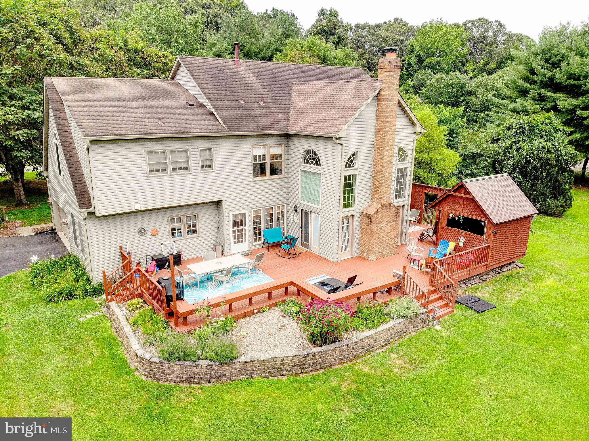 Located in the highly desirable Crofton school district, this is a rare opportunity to own a truly exceptional home that combines grand scale, flexible living, and unmatched convenience.
Welcome to your private retreat in the heart of Gambrills. Situated on a pristine, flat 2-acre lot in the sought-after Patuxent Run neighborhood, this stunning estate offers over 5,000 square feet of beautifully maintained and thoughtfully updated living space with 4 bedrooms upstairs, possible main floor bedroom, and a full apartment or in-law suite in the lower level with a 2nd Kitchen and a separate entrance!
Nestled in a no-thru street enclave off Rt. 450, peace, privacy, and exclusivity come standard—while still keeping you just minutes from major routes, shopping, and the best of the DC-Baltimore-Annapolis corridor.
From the moment you arrive, the stately curb appeal, side-load two-car garage, and expansive lot set the tone. Inside, the grand two-story foyer welcomes you with elegance, flowing seamlessly into a soaring two-story family room anchored by a statement fireplace wall. The open-concept kitchen is the heart of the home, featuring 42” maple cabinetry, a spacious island, solid surface countertops, stainless steel appliances, and easy access to a generous laundry room and garage.
Formal spaces shine with custom millwork—wide crown molding, wainscoting, and thoughtful architectural details grace the dining room and a flexible front room ideal for an office or sitting room.
Upstairs, retreat to the luxurious primary suite complete with a large walk-in closet, spa-style bath with soaking tub, separate shower, dual vanities, and a sitting room. Three additional oversized bedrooms and a full hall bath complete the upper level.
Downstairs, a fully finished lower-level apartment offers the ultimate in versatility and value—perfect for multi-generational living, long-term guests, or rental income. With its own private entrance, full kitchen, spacious bedroom, full bath, living area, and bonus room currently used as a walk-in closet, the possibilities are endless.
Welcome home to Patuxent Run—where luxury lives quietly.