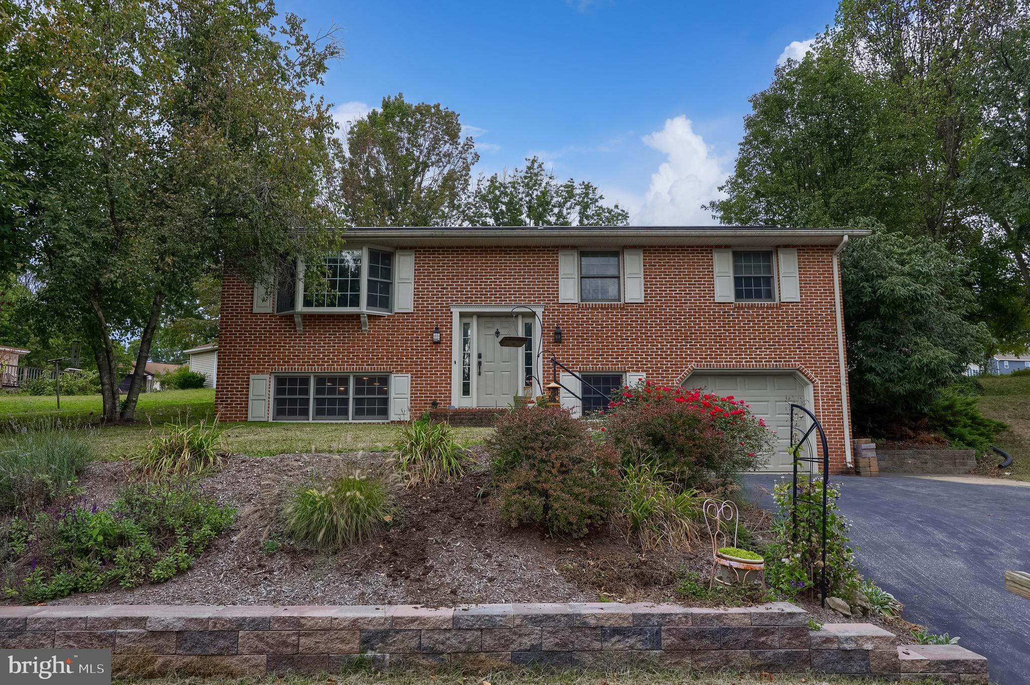 Welcome to 315 Broad Street! Located at the end of a dead-end street, this brick bi-level with an inground pool has over 1,750 sq ft of living space and features 4 bedrooms and 2 full bathrooms. On the main level of the home, you have the living room, which flows into the kitchen and dining area that has a door to the pool area, making it convenient when spending time by the pool. Additionally, there are 3 bedrooms and a full bath on this level. The lower level consists of a second living room space with a propane stove, a full bathroom, an additional room which could be used for a 4th bedroom or office, and the laundry room. There is a door accessing the 1-car garage. The fenced-in pool area makes it a perfect home for entertaining outdoors! The home is conveniently located with quick access to all major roadways and just minutes from the Warwick to Ephrata rail trail! Make sure to schedule a showing and see this home in person before it's too late!