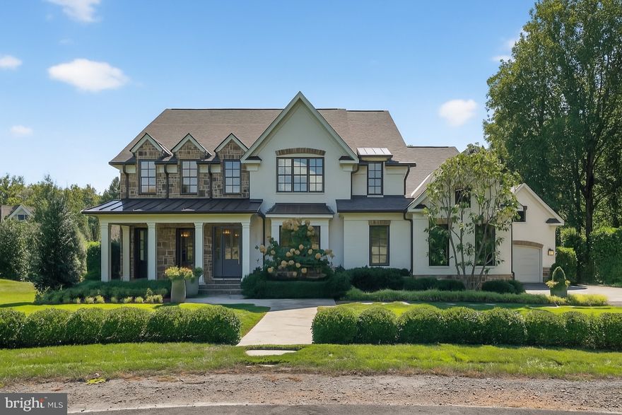 Crafted by renowned artisan builders, this remarkable home is located in a cul-de-sac just minutes to DC, GW Parkway, Schools and Downtown McLean. A gracious foyer introduces beautifully designed interiors, opening to the formal dining room and the inviting family room with coffered ceilings and a gas fireplace. The gourmet kitchen is the centerpiece of the home, showcasing a large center island with pendant lighting, top-of-the-line appliances, a stylish butler’s pantry, and a separate kitchenette with a beverage fridge and two wall ovens. A private office adds convenience, while the screened-in porch with its own fireplace provides a cozy retreat year-round. The upper level boasts a serene owner’s suite with dual walk-in closets and a spa-inspired bath featuring separate vanities, a soaking tub, and a luxurious shower. Three additional ensuite bedrooms and a well-appointed laundry room complete this level. The walk-out lower level is designed for relaxation and recreation, offering a spacious recreation room, wet bar, fitness room, guest bedroom, and full bath. Outdoor living is equally impressive with a patio, fire pit, and seasonal views enjoyed year-round thanks to the private backdrop.