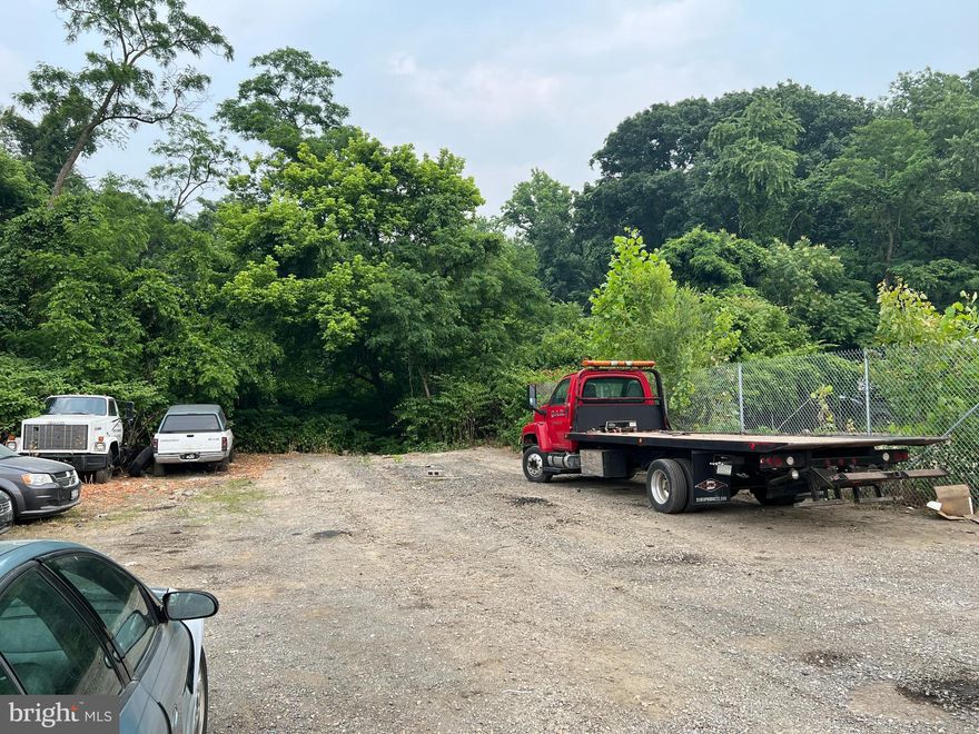 Rarely available W2 zoned property. Great location, close to 695/895/95, located in Northern AA County. Authorized usage includes practically any type of business. Warehouse/ Shop space is ready for your imagination, ability to close off carport for even more covered space. You have the ability to design any office/shop combination space to your liking. Additional 6,000 sq feet of fenced storage yard is also available. More yard space is available if needed. Ideal for automotive, contractor, bulk material storage, construction or trades, Available immediately. This industrially zoned space is rare, it wont last long.