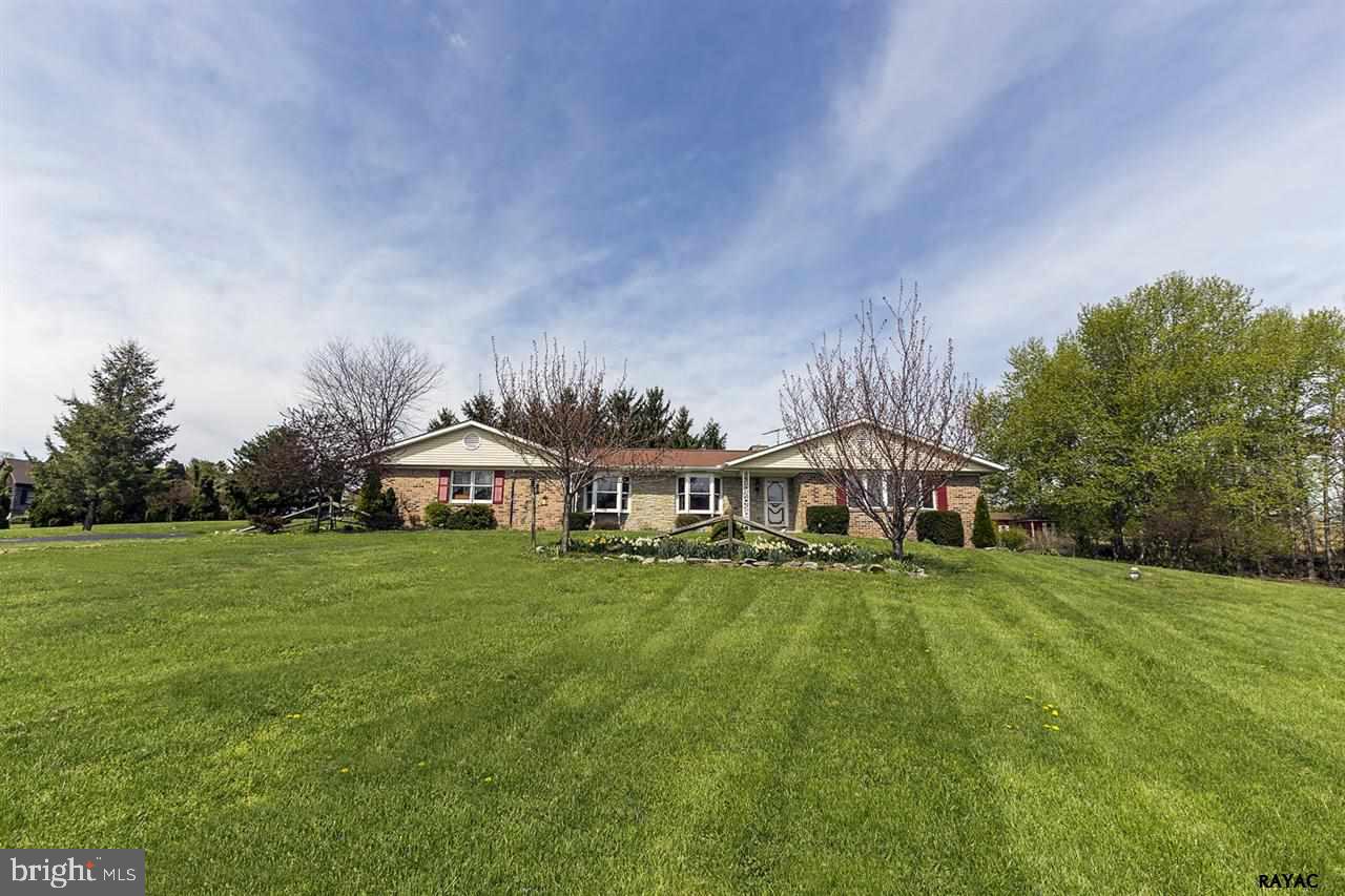 Sprawling rancher on just under 2 acres! This home features a very spacious floor plan with a large living room, dining room, kitchen and a family room with fireplace. Finished lower level with new carpet, den and full bathroom. Updated finishes and like new. Plenty of room inside and out!