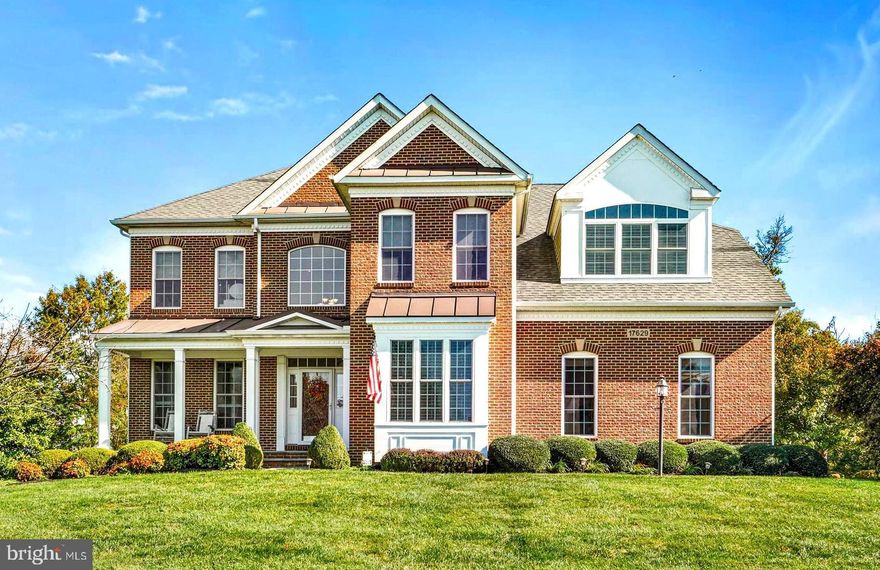 FINALLY, the house you've been looking for in the Stoney Springs neighborhood you've been wanting to live in, is now available in beautiful downtown Poolesville! This is the Winchester-built Oxford II premium model with options on every level, including a main-level open floor plan kitchen (with upgraded cooktop and dishwasher), family room, professional office, and gorgeous hardwood floors everywhere! Four generous bedrooms are upstairs with the primary bedroom featuring a TV/dressing area and enhanced by one of the largest walk-in closets in Poolesville! Bedroom #2 features a private en-suite bath for that favorite person! Bedrooms #3 and #4 share a bath (two sinks) and both bedrooms have ceiling fans. The lower level has even more people space---check the photos---and room  for games or hanging out by the big screen, plus ANOTHER full bath! Bring your gym equipment--you've got space for it now (and tons of storage space too!).  Watch the sunset from your full length front porch then retire to the amazing backyard featuring an incredible two-level stone patio with outdoor fireplace! New hot water heater in 2023. Water softener and drinking water filtration system convey with sale. Walk to top-rated Poolesville High School as well as our community pool and downtown restaurants/shopping. Work from home with ultra high-speed FIOs or enjoy the short drive to 3 different MARC trains as well as Rockville, Gaithersburg, DC, Leesburg, and Frederick! Come join the fun in the best small town and award-winning school cluster in Maryland----Poolesville! Listing agent will always be available to answer any questions and will be happy to show your pre-qualified clients the property for you. By far Poolesville's best value---be prepared to fall in love!