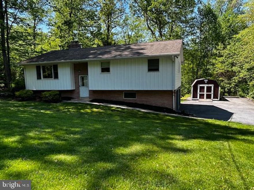 Surround yourself with nature in this 3 bedroom secluded retreat with 2 car attached garage. The main level features a full eat-in kitchen with refrigerator, stove, and dishwasher, and sunroom. Living room, full bath, and 3 bedrooms including the primary bedroom with walk-in closet, primary bath, and mini split system. The lower level consists of a large family room, rec room, half bath, and laundry hookups. Tenants is responsible for utilities.