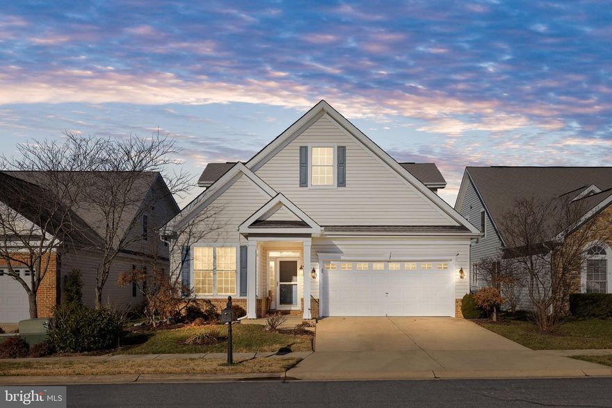 Main level living at its finest in Virginia Heritage! You'll love the details this home has to offer. From hardwood flooring, crown molding, and vaulted ceilings, there's lots to love. The main level boasts formal living and dining spaces, large kitchen with drawer pullouts, gas fireplace and separate office/flex room. On this level you'll also find the first bedroom and full bathroom as well as the massive primary bedroom with private bathroom, complete with soaking tub and double vanities. Upstairs you'll find a nicely sized loft and final bedroom and full bathroom. Enjoy the milder months in the fully fenced backyard with patio and retractable sun shade.  Virginia Heritage is a premier active lifestyle 55+ community, featuring clubhouse, indoor and outdoor pools, fitness center, walking trails and activities. Just minutes to shopping, restaurants, medical and downtown Fredericksburg!