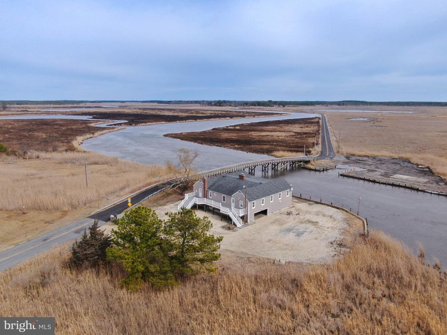 Welcome to Transquaking Lodge, a truly one-of-a-kind property nestled on the banks of the Transquaking River in Cambridge, Maryland, right next to the iconic Blackwater National Wildlife Refuge. Situated on 4 scenic acres, this fully renovated waterfront lodge offers unobstructed views and direct access to one of the most celebrated wilderness destinations in the United States, as recognized by National Geographic.

With over 30,000 acres of protected lands at your doorstep, you’ll enjoy unmatched access to Fishing Bay and Blackwater without the burden of private refuge ownership. This rare waterfront location cannot be duplicated under today’s development regulations, making it an extraordinary find for outdoor enthusiasts, hunters, and conservation-minded investors.

Step inside the expansive 6-bedroom, 3-bath lodge featuring 2,900± square feet of open-concept living space, plus an additional 2,900± square feet of climate-controlled lower-level storage. The heart of the home is a grand stone fireplace anchoring the spacious family room—perfect for gathering after a day in the field or on the water. The open kitchen and dining area create a warm, inviting atmosphere ideal for entertaining.

Originally built in the 1950s, the home was structurally elevated over 6 feet in 2011 to accommodate waterfront conditions and future-proof the property. A comprehensive renovation in 2021–2022 brought modern upgrades including a new kitchen, bathrooms, HVAC systems, insulation, well and purification system, lighting, and more, while carefully preserving the lodge’s rustic character.

Outdoors, your private boat ramp provides quick and easy access to world-class hunting and fishing. Dorchester County is home to the elusive Sika deer, diverse waterfowl, wild turkey, striped bass, snakeheads, and blue crabs, all thriving in this unique ecosystem.

The lower-level offers over 2,900± square feet of concrete-floor, heated storage, perfect for boats, ATVs, kayaks, and gear. Most furnishings convey with the sale (excluding select family heirlooms, taxidermy and boats), making this a turnkey opportunity for a family retreat, hunting club, or income-generating rental.

Don’t miss your chance to own this rare waterfront sanctuary on Maryland’s Eastern Shore.