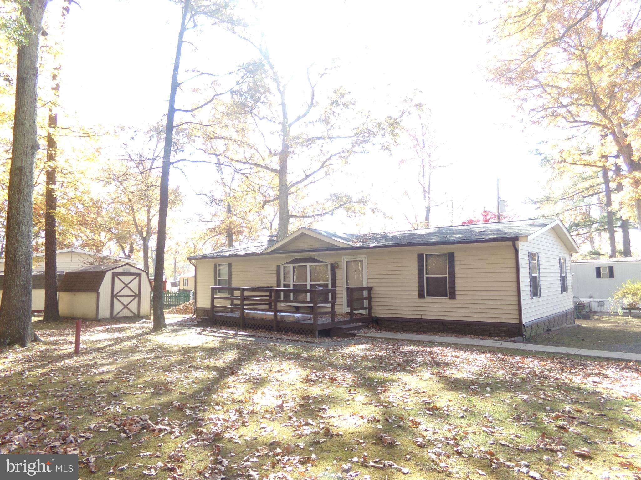55+ community, excellent location and located in we kept community know as Cedarville Mobile Home Park, close to shopping, movies and Mall but feels like you are in the country. This mobile home is on a beautiful lot at the end of the street. Feels like you are on a much larger lot than most, lots of trees for additional privacy. Large deck on front of home and includes a shed for storage.