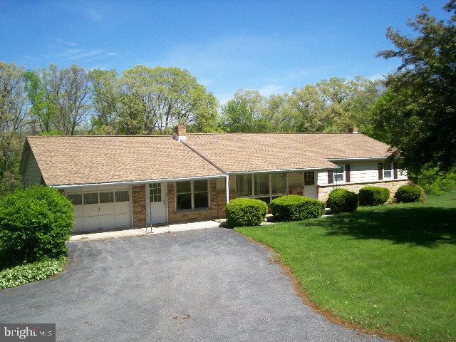 this ranch home is about 6 miles from town; 1 car attached garage with 2 car integral in back of house; large grass yard for the kids; new roof in 2016