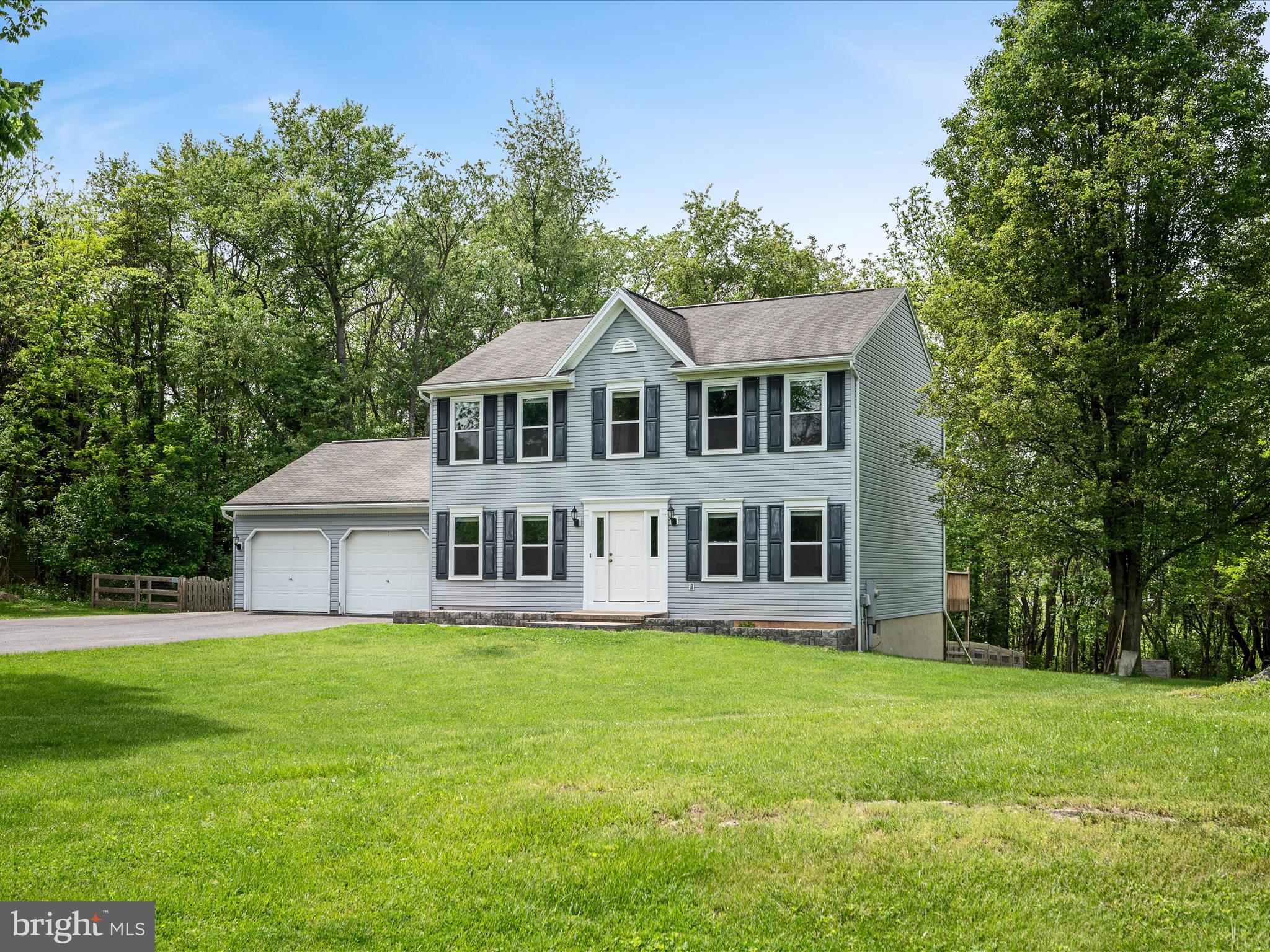 Welcome home to this beautiful 3 bedroom, 2.5 bath colonial, perfectly tucked away on 3 private acres just minutes from the charm of downtown Shepherdstown. This home offers the ideal blend of peace, privacy, and convenience. The main level features a bright and airy family room with expansive windows, seamlessly flowing into the inviting kitchen equipped with stainless steel appliances, a pantry, and a large sliding door that opens to the oversized back deck. Whether you're sipping your morning coffee while watching deer wander through the yard or hosting weekend cookouts, the outdoor space is a true highlight. You’ll also find a versatile flex room that makes a great office or formal living room, along with a separate dining room that's perfect for entertaining. Upstairs, the primary suite is a true retreat, complete with a spacious walk-in closet and ensuite bath featuring dual vanities and a linen closet. Two additional bedrooms, a full bath, and convenient upstairs laundry complete the second floor. Downstairs, the partially finished basement offers a cozy rec room ideal for movie nights or gaming, plus an unfinished space ready for your vision whether that’s a workshop, gym, or additional storage. Outside, you’ll enjoy a fenced backyard, a large storage shed, and extra parking beside the 2-car garage, perfect for your boat or camper. And if you’ve been dreaming of fresh eggs in the morning, good news-chickens are allowed! Recent updates include a brand-new architectural shingle roof (June 2025), fresh interior paint, a new front door, and all new windows throughout the home (2024). Whether you're relaxing on the deck, exploring nature, or heading into town for shopping and dining, you'll love the peaceful setting and easy access to everything Shepherdstown has to offer. Don’t miss your chance to make this private retreat yours. Schedule your showing today!