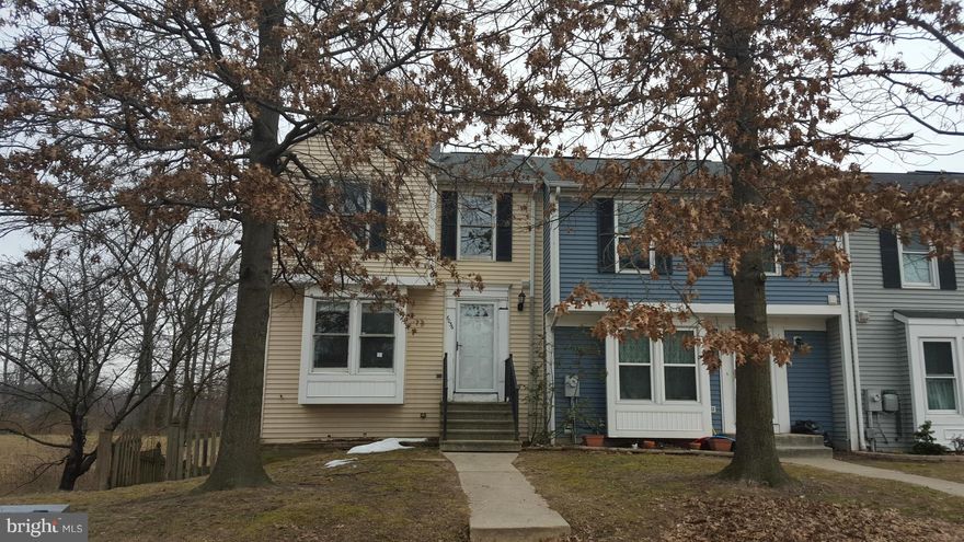 End of unit Town Home with a nice deck and fenced rear and side yard.  This home offers a great layout and the possibility to finish the basement to your own liking. High ceilings in the lower level. Sunken living room  area with sliders to the deck.  Spacious kitchen and dining area with sunken living room. The rear backs to an open space and trees!  Come take a look, and bring you best offer!