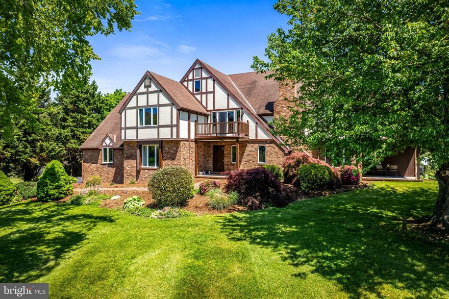 Welcome to 203 Locust Hill Drive in sought-after Churchville, where space, comfort, and peaceful surroundings come together on an incredible 3.5-acre property designed for both everyday living and unforgettable entertaining.  Opportunities to own in this highly desirable neighborhood are rare, making this custom-designed English Tudor home with 6 bedrooms and 4 full bathrooms an exceptional offering for buyers seeking space, privacy and flexibility.  As you step inside, you’re welcomed by a spacious foyer that immediately sets the tone for the home’s warm and inviting flow. The main level effortlessly connects the living room, dining room, kitchen, and family room, creating the ideal layout for gatherings both large and small.  Also on the main level is a generously sized bedroom with an attached bathroom —an increasingly desirable feature for buyers seeking flexibility for guests, multi-generational living, or convenient main-level living options.  The updated kitchen is a chef's delight, featuring ample cabinet space, quartz countertops, stainless steel appliances and a center island perfect for meal prep and entertaining.  Just off the kitchen, the spacious family room is truly a standout feature, offering high ceilings, abundant natural light, a cozy fireplace with a pellet stove and built-in bar area.  It's the perfect space for everyday living, relaxing evenings, or entertaining guests.  Upstairs, you’ll find a truly spacious primary suite designed to feel like a private retreat. Complete with a comfortable sitting area, large walk-in closet, and spa-like bathroom with a soaking tub and standing rain shower - a perfect place to unwind at the end of the day.   Four other bedrooms complete the upper level with one being as spacious as the primary.  Currently used as a bedroom and exercise room, it can easily be used as a home office, playroom or upper-level family room too.  Step outside and the property becomes your own private escape. Set on 3.5 flat, usable acres, the backyard offers endless possibilities for recreation, entertaining, or simply enjoying the peaceful setting from your porch or patio.   The beautifully fenced,  in-ground  pool creates the perfect centerpiece for summer gatherings, quiet mornings, and evenings spent relaxing under the stars.  This is more than just a home—it’s a property designed for comfort, flexibility, rest, and relaxation both inside and out.  Notable updates:  2026 - new pool pump; 2025 - Gunite pool & pool tile redone; 2022 - front sidewalk redone with brick; 2021 -  updated kitchen/baths