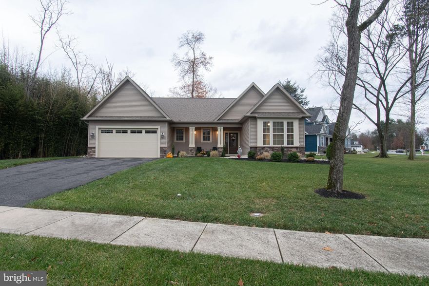 Nestled on a private cul de sac of 11 homes this charming one story home displays  pride of ownership offering a multitue of custom details throughout. You will appreciate the easy living style this home affords showcasing hardwood flooring in the  public living areas along with stunning gourmet kitchen with white cabinetry, soft close drawers, vented SS hood, granite countertops, gas cooktop, double wall oven, built in microwave. convenient butler area, dining room seating for 10, an open concept floor plan with cozy gas fireplace and tv area that can be viewed from the kitchen, dining and the gathering room. There is a guest bedroom with a box bay window, a room featuring French Doors off the gathering room that can be utilized as another guest bedroom, or a office/study for those who work from home. The Owner's Suite  boasts a walk in closet and a spa style Owner's Bath. There is a mud/utility room/plentiful storage and a spacious 2 car garage.   A triple sliding glass door leads to a expanded patio overlooking a private rear yard with expansive irrigation system all around.  Best of all this lovely home is within walking distance to downtown Mullica Hill offering a cornucopia of upscale boutiques, coffee shops. seasonal events...truly a wonderland for all ages. Perfect for first time homebuyers or those wishing to downsize . This one is worth the wait!!!