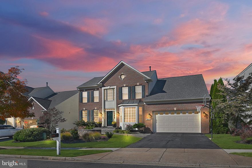 This fantastic home in the Villages of Urbana feels like a private retreat! Situated on a quiet street, this beautiful brick front home features professional landscaping that captures the beauty of the changing seasons! Follow the stone walkway and stone path to find the ultimate backyard oasis! Fenced and surrounded by trees and backing to privacy--the well-designed yard provides all the elements for great entertaining! The heated pool, complete with nighttime LED lights, and the hot tub are surrounded by beautiful plantings and plenty of flat green space for playing sports. The multiple areas for enjoying the outdoors include the poolside pergola, the expansive deck, covered patio (perfect for playing games in the shade), and the extra-large screened-in room with fantastic views.  The interior features upgrades galore--including fresh neutral paint,  upgraded lighting, Plantation shutters, hardwoods and a convenient office. The recently upgraded gourmet kitchen is perfectly appointed in today's style--with Stainless steel appliances, white cabinets, gray center island , quartz counters, custom backsplash and a convenient beverage center! The light-filled morning room with a volume ceiling provides a spacious area for family meals and walks out to the screened room and deck.  In the family room, a gorgeous stone fireplace and built-in bookshelves provide a welcoming area for family gatherings. The lower walk-out level boasts additional space for entertaining--including  recreation areas and theater with 110 inch screen and a custom wrap-around wet bar  with granite counters and tons of cabinetry.  Through the French doors, there is a spacious bonus room--perfect for a work-out room, separate media room or game room. On the upper level, the luxurious Owner's Suite features crown moldings, and a freshly painted spa bath with new quartz counters , fixtures and lighting! All this, plus three more large upper bedrooms and a convenient hall bath. This gorgeous home is a must see!