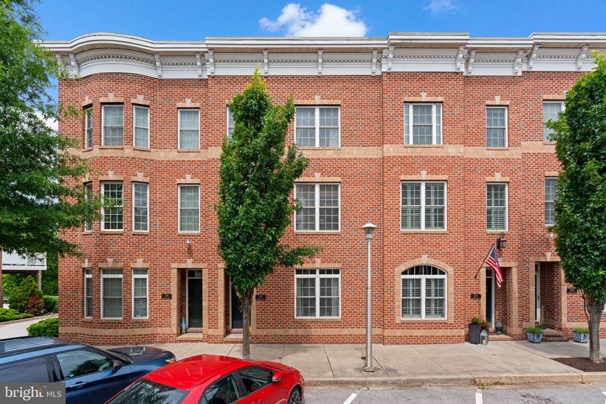 Come see this one of a kind WATERVIEW  home in the highly sought after community: The Townes of Locust Point. This house is the best in the neighborhood with an open floor plane, upgraded kitchen and bathrooms, hardwood floors and more. The first floor boasts a sizeable bedroom/office and updated full bathroom. At the back of the house you have a huge 2-car garage and 2 car parking pad behind the garage (you won't find this amount of parking anywhere else in locust point). The  second floor is your main level with open living, dining, kitchen and an updated half bath. The kitchen has been upgraded with quartz counter tops, tile backsplash, and stainless appliances. Behind the kitchen leads to an expansive back deck perfect for meals (also not found in other houses in Locust Point). The third floor boats a massive primary suite with a totally remodeled bathroom. In the hall there is another updated full bath, laundry, and linen closet. The other bedroom is large enough to be easily converted into 2 separate bedrooms if desired, making it a 4 bedroom house. Just a wall, a couple doors and move the closets and you have a 4 bedroom house if that is a better fit for your family. Up one more flight of stairs you have a wet bar with fridge leading to a massive roofdeck. The views on the deck are amazing. You can see the inner harbor, Domino sugar sign, and city skyline. Perfect for day or night. This community has plenty of extra parking and low HOA fees, which cover landscaping and snow removal. Walking distance to the harbor, Federal Hill, Harris teeter, restaurants and more. Come live in the best community in all of Baltimore.