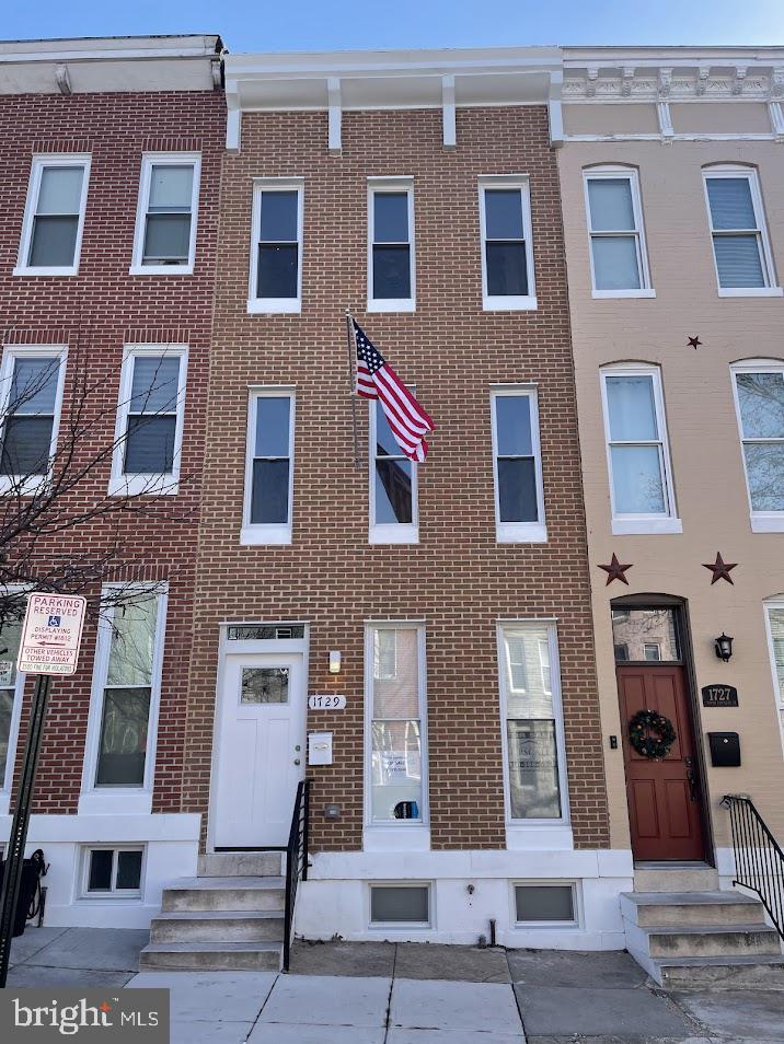 Everything new… Rebuilt/renovated from the ground up. All new electric (200 Amp), plumbing, HVAC (2 systems), HWH (50 Gal), windows, roof, front brick façade, back brick walls, rear deck, paved and fenced back yard and new floor layouts throughout. 4 BR, 4 ½ Bath 3 above grade levels and a finished basement. Exquisite open main level with tray ceilings and chair rail molding. Large kitchen with upscale appliances, counters, backsplash and abundant designer base and 42” wall cabinets adjacent to a separate dining area. Laundry with stackable washer/dryer at rear of main level along with a half-bath. Electric fireplace in front living room along with built-in book/display shelves. 2nd floor Master suite with large walk-in closet and attached bath. 2nd floor also includes large front bedroom, a full bath, and an HVAC utility closet a portion of which can be used for storage. Ceiling fans, recessed lighting throughout home. 3rd floor has 2 bedrooms and a bath. As your needs dictate the smaller bedroom can be used as a nursery, office space or as a huge walk-in closet/storage or some combo thereof or the whole top floor can be considered another master suite. Basement has a large front multipurpose room and a center family room, and a large full bathroom with walk in shower. An enclosed utility area housing the HWH and sump pump can provide additional storage space. Home is located on a great block with friendly neighbors with a wide Street. Bus lines (CL- Gold and LL-54) close by. Home is approximately a mile from the main Hopkins Hospital campus and 2.5 miles from Baltimore City Center (Baltimore St. and Charles St.). Overall an amazing upscale urban Townhouse.