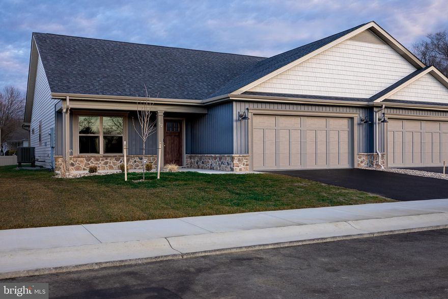 THE LAST 3 BEDROOM VILLA BEING BUILT IN THIS NEW COMMUNITY!  Construction of this home is ALMOST complete!  October delivery.  Pictures are of a different home, different finishes - but same floorplan.  Welcome to The Villas at Warm Springs - Berkeley County's newest 55+ Community.  This quaint community is made up of only 14 Villa homes and offers a peaceful setting with sidewalks throughout.  It is conveniently located close to shopping, restaurants, medical facilities and has easy interstate access.  Mowing of your lawn, curbside trash pickup, road maintenance and snow removal of your driveway, sidewalks and the roads are all included as part of your HOA dues!  All villas come standard with a beautiful ceramic tile zero barrier Owner’s Shower, matte black lever door handles and fixtures, architectural grab bars in the Owner’s Suite bathroom and quartz or granite countertops throughout the kitchen and bathrooms.  Enjoy the ease of mobility with 36" doorways, no step thresholds and LVP throughout the main level.  A large laundry room with a sink is located immediately outside of the Owners Suite bedroom. Huge Bonus Room is upstairs - perfect for guests, hobbies or storage! These features provide low maintenance living so you can enjoy accessibility throughout your new home.  The yard has been finished with lush sod, river rock landscaping and low maintenance shrubs.   Construction in the neighborhood is nearing completion.  Several homeowners are already enjoying their new homes in The Villas at Warm Springs, stop by and see if this home would be the right move for you!