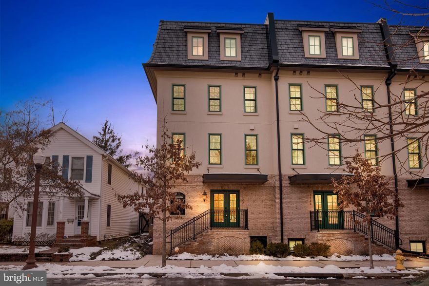 ***OPEN HOUSES CANCELLED 1/27 AND 1/28*** 

Introducing a luxurious gem nestled in the heart of Ballston– a stunning 2017 townhouse that epitomizes modern elegance and sophistication. This rarely available Ballston Oak, end-unit townhome is spacious and light filled. This meticulously crafted residence boasts four bedrooms, providing ample space for both relaxation and entertainment.  

Your welcoming entry-level has a grand foyer, where sleek hardwood floors lead you to a huge mud-room closet space as well as a powder room and direct access to the sizable 2 car garage.  From here you can head downstairs to access the lower-level sanctuary or upstairs to access the kitchen and family room.  

The gourmet kitchen is a culinary enthusiast's dream, featuring Kitchen-Aid stainless steel appliances, quartz countertops, and an oversized island which is great for entertaining or eating breakfast. The walk-in pantry provides plenty of extra kitchen storage.  Host intimate gatherings or lavish dinner parties in the elegant dining area which flows into the living room adorned with a gas fireplace. The hardwood floors from this level continue upstairs to the bedroom level and top level.  

The next floor hosts the primary suite which is generously appointed with walk-in and wall closets as well as a bright primary bathroom with an oversized tiled shower and dual vanities. Large windows fill the rooms with natural light by day and custom roller shades bring privacy at night.  Each bedroom on this level is accompanied by its own ensuite bathroom, featuring modern fixtures, tile and spa-like amenities. 

The top level includes a bedroom and full bath as well as a second family room living space or rec room. The top level opens to a private patio with a skyline view.  In July, the Washington DC fireworks are visible from this level.    

The lower level includes a generously sized 4th bedroom with a wet bar as well as a luxurious full bath which is perfect as a guest suite. The additional finished space on the lower level could be used as a guest-den, exercise room, an office or additional storage.   

Enjoy the convenience of a two-car garage and ample storage space for all your needs. 

All windows are outfitted with custom roller shades from The Shade Store to enhance privacy and add a unique and personalized touch to the light filled home.  

Located in the desirable Ballston neighborhood, this residence is just moments away from a myriad of dining, shopping, and entertainment options. With easy access to Ballston MU Metro Station, public transportation and major thoroughfares, the best of Arlington and beyond is at your fingertips. 

Don't miss the opportunity to make this exquisite luxury townhouse your home – where contemporary living meets timeless elegance. Schedule your private tour today and experience the epitome of upscale urban living.