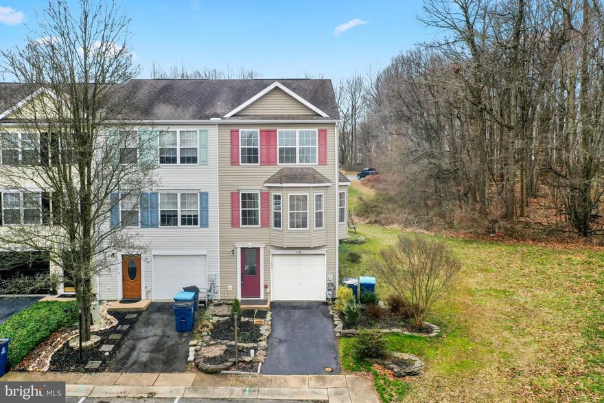 Welcome to your cozy end-of-row townhouse with 3 beds, 2.5 baths, and a one-car attached garage. Enjoy the convenience of major roads nearby. Inside, find a bright living area, modern kitchen, and two spacious bedrooms with en-suite bathrooms. Relax on the private patio or explore the vibrant neighborhood. Perfect for comfortable living in a prime location. Schedule a showing today! Sellers are having carpet installed in basement ( will be finished before settlement ). Photos are virtually staged.