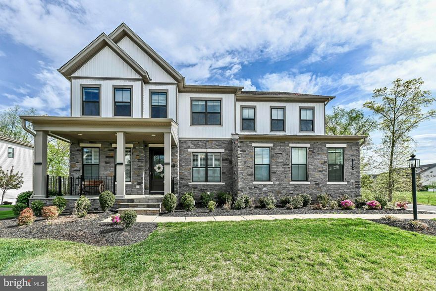 Welcome to this stunning Toll Brothers Richardson model, offering over 6,800 square feet of thoughtfully designed living space in the heart of Aldie in the sought after Lenah Mill Community. Perfectly situated on a premium end-row lot backing to mature trees, this home combines luxury finishes, privacy, and exceptional versatility for today’s lifestyle.

Originally built with over $100,000 in builder upgrades, this home showcases high-end design throughout, including wide-plank engineered hardwood flooring, designer tile selections, and a beautifully curated chandelier that adds an elegant focal point. The gourmet kitchen features quartz countertops with a waterfall edge, a full-height backsplash, and a complete suite of KitchenAid stainless steel appliances.

Designed with flexibility in mind, the home offers two additional bedrooms and two dedicated office spaces, along with a multi-generational primary bedroom on the main level, making it ideal for extended family, guests, or private workspace needs. Custom built-in closets provide both style and functionality, while a mudroom adds everyday convenience.

The open-concept main level is complemented by fresh interior paint, creating a bright, modern feel throughout. Each bedroom is equipped with its own ceiling fan for added comfort. Step outside to enjoy the newly built deck overlooking a peaceful, tree lined backdrop, perfect for entertaining or relaxing.

This home is also equipped with a variety of smart home and security features, including a wireless garage door opener, Ring doorbell, and a 360-degree security camera system, offering both convenience and peace of mind.

Additional highlights include:

Recently serviced HVAC system (2026), 
Two-year supply of high-quality HVAC filters, 
Spacious lot with enhanced privacy and curb appeal, 
Move-in ready condition with thoughtful upgrades throughout. 

Located with convenient access to major commuter routes, shopping, dining, and top-rated schools, this home presents a rare opportunity to own a truly upgraded and versatile property in a prime location.