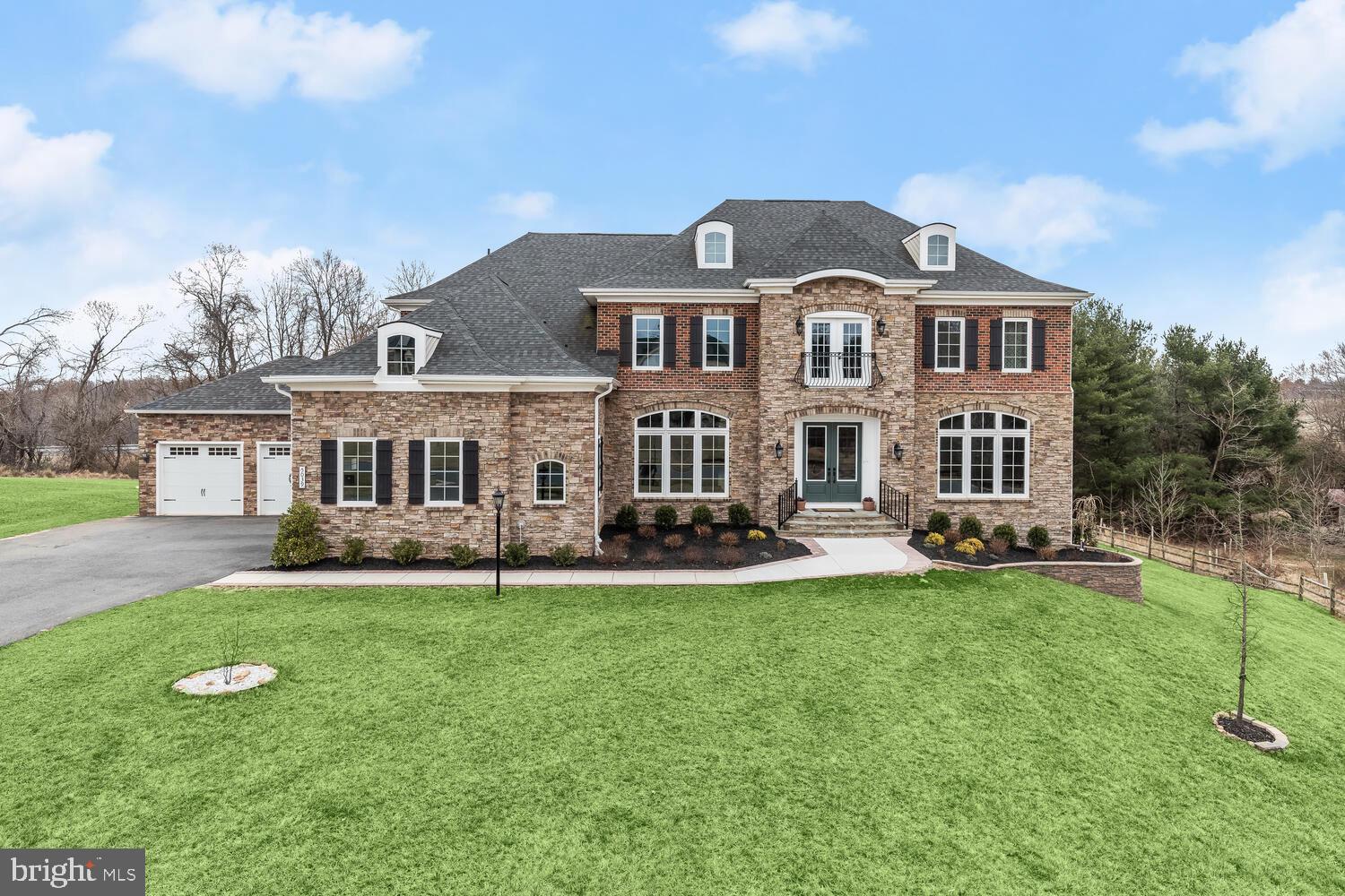 Sited on a beautiful premium lot; custom built NV Home on 1.29 sprawling acres; embellished with mature trees and lush landscaping. Located in the desirable Clarksville setting of Gaither’s Chance. Architectural custom masterpiece; pristinely maintained by the original owners offering sophistication, elegance, style, and grace. The Monticello II is a rare find. Its exquisite front entry two story foyer, welcomes you inside to a grand center hall curved staircase, clothed with wrought iron railings, and enhanced with beautiful hardwood flooring and intricate lighting. Adjacent formal living and dining rooms provide multiple gathering spaces complemented with crown moldings and gorgeous sunbathed floor to ceiling arched windows. A Chef inspired entertaining, kitchen with a second staircase is sure to impress. Adorned with a breakfast bar, custom cabinetry, professional grade appliances, double wall convection ovens, gas cooking, pot filler, tile-glass backsplash, quartz counter tops and a massive center-island that will be the envy of the buffet conversation. A butler’s pantry serving center, leads to the formal dining area. Ample walk-in pantry will allow space for food lifestyles. The open breakfast room house a hutch with a wine cooler which compliments the kitchen. Enjoy after-dinner nightcaps or perhaps read the morning paper in the impressive and cozy sunroom, a perfect space for anytime of the day or night. An adjacent two-story grand, family room with coffered ceiling, highlights a marble, gas burning fireplace accented with floor to ceiling windows. The main level home office or library is graced with French doors and custom built-in bookcases. Circle to the grand center curve staircase that overlooks the family room and takes you into the primary suite offering generous proportions of versatility while boasting crown molding, tray ceiling and a ceiling fan. It allows a dressing area, and phenomenal walk-in closets. While the luxurious en suite bath equipped with new tile flooring, tray ceiling, separate vanities, oversized double shower, air-jetted soaking tub, and a large linen closet, this master suite will be your daily retreat. In addition to a bedroom level laundry, and hallway linen closet, there are three spacious en suite bedrooms each with a walk-in closet, ceiling fan, and plush carpeting that provide exceptional private sleeping spaces. As you walk along the Catwalk, a lovely reading nook, grace the Juliet balcony flanked by double French doors and Wrought Iron Railings conclude the upper level. The impressive walkout lower level lends itself for potential multi-generational living complemented with new luxury vinyl plank flooring, a custom wet bar, fifth bedroom, full bath with walk in shower, recreation rooms, gaming area, home theater, additional storage, and walkout to a private retreat in the backyard. Enjoy the tranquil tree lined views, morning sunrise, and evening sunsets as this rear home and haven is waiting for you!