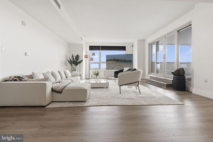 Welcome to The Residences at Dockside—this expansive 3-bedroom, 2.5-bath home offers over 1,900 sq ft of beautifully updated living space with stunning Delaware River and Center City skyline views. Featuring an open-concept layout, wide-plank flooring, oversized windows, and a sleek updated kitchen with stainless steel appliances and stone finishes, this home is designed for both comfort and entertaining. The spacious primary suite features a private balcony and renovated ensuite bath, while two additional bedrooms offer comfortable space ideal for family living. Enjoy a private terrace, in-unit laundry, and assigned parking. Most furniture is included, offering a move-in ready opportunity. Residents enjoy resort-style amenities including 24/7 concierge, gated parking, fitness center, hot tub, clubroom, and a large riverfront patio. Ideally located steps from Spruce Street Harbor Park, Blue Cross RiverRink, top restaurants, and with easy access to I-95, bridges, and the airport—this is waterfront city living at its best.