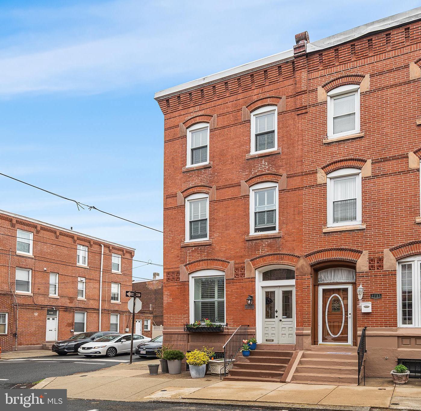 This beautifully restored corner townhome seamlessly blends historic charm with modern luxury in the heart of Philadelphia’s Art Museum/Fairmount neighborhood. Situated on a coveted block, 2737 Brown Street spans an impressive 2,886 sq ft. of living space, offering 4 bedrooms plus a den, and 3.5 bathrooms. Completely renovated in 2010, the home features meticulously restored original red pine flooring and elegant architectural details throughout with natural light flooding in from the front, side and rear. The first floor welcomes you with a formal living room featuring a gas fireplace, a spacious dining room, and a custom chef’s kitchen equipped with granite countertops, a breakfast bar, high-end appliances, and a wine refrigerator. A convenient powder room completes this level. Step outside to a private stamped concrete yard—your own peaceful retreat, perfect for morning coffee or family gatherings. On the second floor, the luxurious primary suite boasts a large shower with slate flooring, while a front bedroom suite offers a charming bay window and a custom seamless glass shower. The third floor provides two additional bedrooms, a den, and a full bathroom, offering plenty of flexibility. The basement is ready to be finished, making it ideal for a playroom or home gym. Additional highlights include dual-zone heating and cooling, high ceilings, and a newer water heater. A true gem in one of Philadelphia’s most desirable neighborhoods, within blocks to favorite restaurants, Whole Foods, iconic museums, the Schuylkill River trails, and all the city conveniences you could ask for. Seller is offering one year prepaid parking at a neighborhood lot.