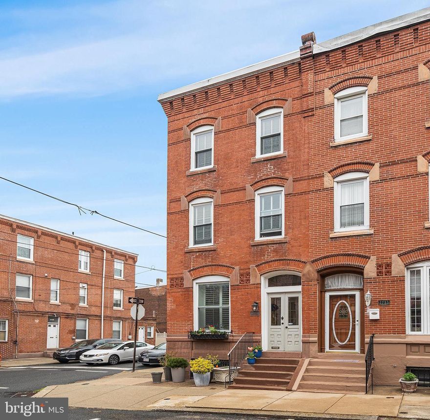 This beautifully restored corner townhome seamlessly blends historic charm with modern luxury in the heart of Philadelphia’s Art Museum/Fairmount neighborhood. Situated on a coveted block, 2737 Brown Street spans an impressive 2,886 sq ft. of living space, offering 4 bedrooms plus a den, and 3.5 bathrooms.  Completely renovated in 2010, the home features meticulously restored original red pine flooring and elegant architectural details throughout with natural light flooding in from the front, side and rear. The first floor welcomes you with a formal living room featuring a gas fireplace, a spacious dining room, and a custom chef’s kitchen equipped with granite countertops, a breakfast bar, high-end appliances, and a wine refrigerator. A convenient powder room completes this level. Step outside to a private stamped concrete yard—your own peaceful retreat, perfect for morning coffee or family gatherings. On the second floor, the luxurious primary suite boasts a large shower with slate flooring, while a front bedroom suite offers a charming bay window and a custom seamless glass shower. The third floor provides two additional bedrooms, a den, and a full bathroom, offering plenty of flexibility. The basement is ready to be finished, making it ideal for a playroom or home gym.  Additional highlights include dual-zone heating and cooling, high ceilings, and a newer water heater. A true gem in one of Philadelphia’s most desirable neighborhoods, within blocks to favorite restaurants, Whole Foods, iconic museums, the Schuylkill River trails, and all the city conveniences you could ask for. Seller is offering one year prepaid parking at a neighborhood lot.