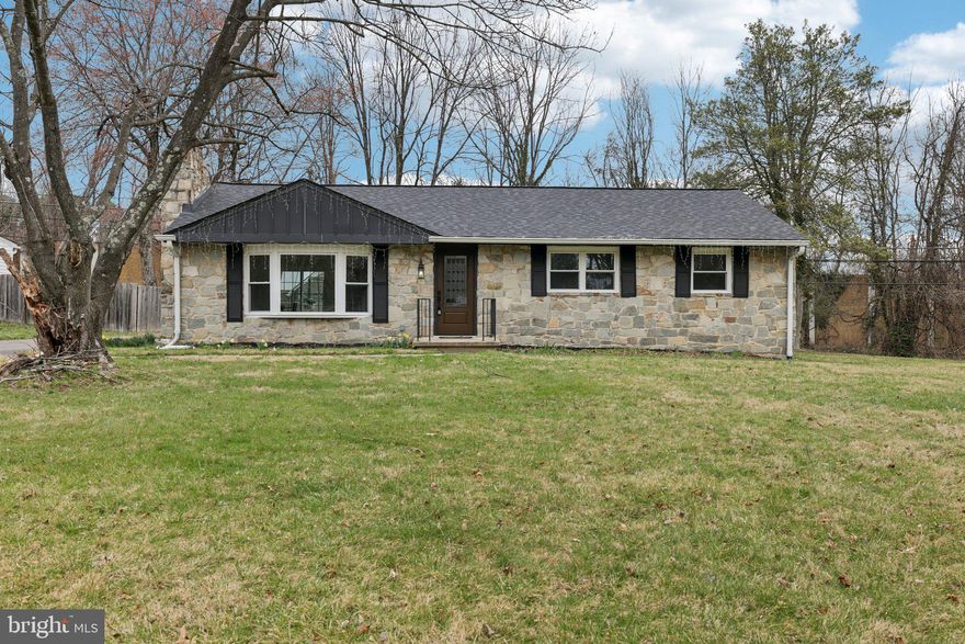 Beautifully renovated brick front rancher with finished basement on a premium corner lot just over half an acre. Updated in 2022, this home offers modern finishes, functional living space, and a highly desirable location near major commuter routes.

The main level features beautiful luxury vinyl plank flooring throughout and a bright, open layout. A sunken living room with a large bay window and floating fireplace creates a striking focal point and fills the space with natural light. The updated kitchen includes quartz countertops, a generous center island, stainless steel appliances, and a dedicated dining area. Just off the kitchen, a patio extends the living space outdoors and is ideal for entertaining.

The main level includes three bedrooms, including an owner’s suite with a renovated en suite bathroom. All bathrooms in the home have been fully updated with modern finishes.

The finished lower level offers a spacious rec room with walkout access to the large backyard, providing flexible space for a second living area, home office, or recreation.

This stunning home is conveniently located just minutes from St. Johns Lane Elementary School, parks, shopping, and dining, with convenient access to I-70, I-695, Route 40, Route 100, and Route 29.