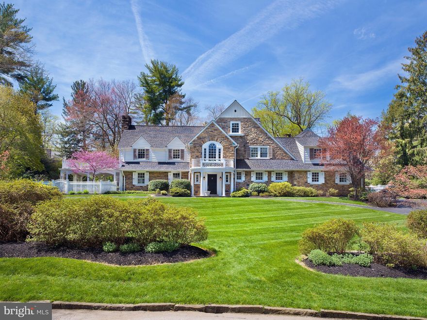 Beautifully sited on one of Bryn Mawr's most desirable streets, this classic Wallace and Warner stone & clapboard estate home was solidly constructed in 1930, has been renovated and expanded by Gardner Fox and is exquisite inside and out. A circular drive lined in Belgian block, stunning mature landscaping, rose/perennial gardens and handsome curved stone walls, welcome you home. This stately Main Line residence offers peace and privacy with 6 bedroom suites (5 on the second floor), 7 full baths and 2 powder rooms. The estate grounds have a recently renovated 20 x 40 swimming pool which is perfectly positioned and not visible from most rooms, flagstone terraces for entertaining, an expansive level area for sporting activities and a covered patio for relaxation. â¨â¨Meticulously maintained, thoughtful infrastructure improvements include a 2015 roof, new basement windows in 2020, third floor windows in 2021, 21 Pella and Marvin windows installed in 2000 (7) and 2015 (14). Azek railings on front & side porches in 2021, refinished wood flooring and new flooring in kitchen and cabana area, exterior painting in 2021-2022 and James Hardie siding in 2021.
 
Professionally decorated interiors with Farrow & Ball painting, custom interior shutters and Conrad window shades, offer every luxury amenity. Among them is a stunning custom chefâs kitchen with Kountry Kraft cabinetry, full suite of premium quality appliances, large island and radiant heated flooring. An adjacent breakfast room features a gas fireplace and charming window seat. The desirable floor plan perfectly aligns the nearby family room. Brightened by natural light and enhanced with a fireplace and Sherman and Gosweiler custom cabinetry, it can accommodate casual or grand entertaining. Elegant architectural features and decorative moldings are evident in the generously sized living and dining rooms which provide breathtaking views of the grounds. A large cabana area with full bath provides convenient access to the pool area and atrium style greenhouse.
 
Five en-suite bedrooms (4 with cathedral ceilings) are found on the second floor. The highlight is the primary bedroom suite addition by Gardner Fox featuring windows on 3 exposures, a spa-like bath and sitting/dressing room with custom wardrobe cabinetry.  A study offers an ideal space for homework while a separate den is perfect for watching movies.  The second floor laundry room and full bath offers convenience.
 
A bedroom suite with bathroom, large sitting room, walk-in and cedar closets can be also be used as a home office.
 
This quintessential Main Line home is distinguished by its timeless architecture, modern floor plan, quality construction, and breathtaking grounds which combine to elevate it one of the very highest tier of Main Line properties.