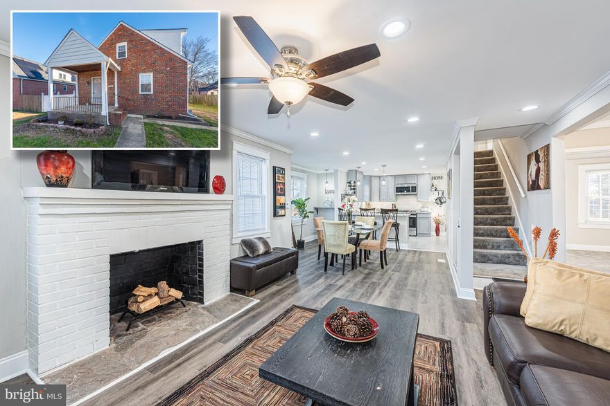 BEAUTIFULLY DESIGNED CUSTOM RENOVATION WITH OVER 2,600 SQ. FT. OF LIVING SPACE!  Open floor plan with an inviting living room with crown molding & wood fireplace, separate dining area, designer kitchen with breakfast bar, ss appliances, & granite counters, 2 main level bedrooms with a hall bath, upper level Primary bedroom suite with a full bath and a 4th bedroom, fully finished basement with a large family room, 5th bedroom, and 3rd full bath, a detached unfinished space that can also be used as storage or finished into an office, exercise room, or workshop, a truly unique rooftop deck, a spacious rear yard that's great for entertaining and driveway parking (to be installed).  Pack your bags and move right in!  Seller to install door to deck from the 2nd level