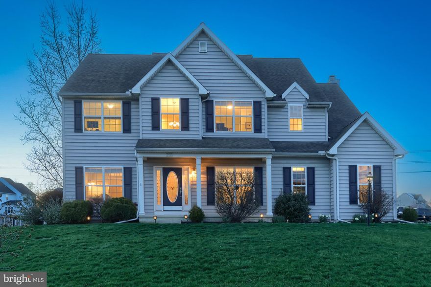 Stunning 5 bed, 4 bath home in the London Croft neighborhood, Palmyra Area School District! Step into a soaring two-story foyer with hardwood floors and crown molding throughout the home. The fully finished walkout basement features a theater/media room, full bath, wet bar with sink, and a home gym or potential 6th bedroom. The main level has an open floor plan and bright, sun-filled rooms. The gourmet eat-in kitchen features double wall ovens, quartz countertops, gas cooktop, new modern slate appliances, a tile backsplash, an oversized island with seating, and a breakfast area with direct access to the covered deck. The adjacent family room has a wood-burning fireplace, recessed lighting, and gorgeous vinyl plank flooring, and the elegant formal dining room features a tray ceiling, wainscoting, and a transom window. A front sitting room or office, laundry room with chute, and powder room complete the main level. The second level offers 5 spacious bedrooms with new luxury vinyl plank floors, including an owner’s suite with sitting area, walk-in closet, dual vanities, soaking tub, and a walk-in shower. Outside, pull up a chair, kick back, and enjoy beautiful sunset views from the covered deck or lower-level patio. The fully fenced yard includes established trees that provide natural privacy and a separate grill area. A side-loading two-car garage, welcoming front porch, storage shed, and a new A/C system complete this exceptional home. Call today to schedule your private tour.