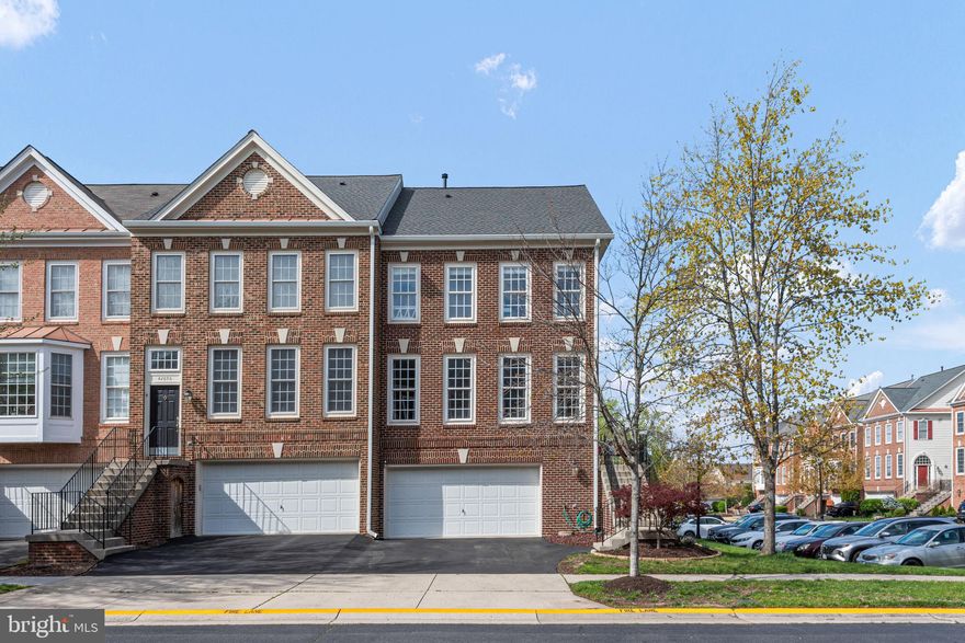 Welcome to this stunning light and bright end-unit townhome nestled in the desirable South Riding community, boasting a two-car garage and a unique 3-level bump out. This renovated home features four bedrooms, three and a half bathrooms, and a generous 2,653 square feet of tastefully designed living space.

Upon entry, you're greeted by a newly tiled foyer. Step up to the spacious living room adorned with beautiful cherry hardwood floors throughout the main level. The heart of the home lies in the open-concept kitchen, showcasing 42-inch cabinets, sleek granite countertops, and stainless steel appliances, including a gas range and a side-by-side refrigerator. Adjacent to the kitchen, the dining room offers ample space for entertaining, and the cozy family room has a gas fireplace and a sliding glass door that leads to the large deck that was recently stained.

Ascend to the upper level and bask in the abundant natural light pouring through the large picture window. The primary suite boasts vaulted ceilings, a walk-in closet, and a luxurious renovated bathroom featuring dual vanities, quartz countertops, and an expansive tiled shower with a seamless glass door (2019). Two additional bedrooms and a full hall bath complete this level, providing ample space for family, guests, or a home office. The convenient upper-level laundry closet offers a brand-new washer and dryer (2024).

The lower level of the home offers a recreation room, a fourth bedroom, a remodeled full bathroom (2019), and a walkout to the patio and fenced rear yard. The two-car garage offers extra space on the side. 

Residents have access to pools, tennis, basketball courts, parks, playgrounds, and soccer fields, along with the convenience of nearby shopping and restaurants. This is a perfect place to call home! Roof and gutters - 2023, HVAC 2016.