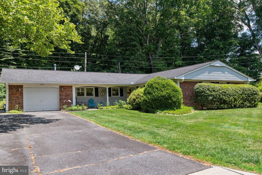 This home is a great opportunity to own a spacious three bedroom two-bath brick and siding rambler on a quiet cul-de-sac in the Yorktown subdivision. Situated on a private ¾ acre lot, this mid-century contemporary has a covered front porch / entry portico - perfect for sitting in a deck chair and enjoying the tranquil neighborhood. The tiled entry foyer leads to a living room/dining area. The living / dining room is bathed in light from a bay window and brightened by the white oak floors.  The eat-in kitchen is equipped with a side-by-side stainless steel refrigerator, a gas range, a built in microwave and ample upper and lower cabinetry.  The adjacent spacious family room has an island and a sliding glass door opening up to a patio flanked by a garden with native plants, a storage shed and woods that flow into the deep property.  A separate laundry room sits between the family room and access to the garage. 

A hall leads from the living room to a bright primary bedroom with ample space for a king-sized bed. The large main bedroom boasts a double closet and an ensuite bath with a generous sized shower.   Two additional bedrooms, both affording the space for queen sized beds, are equipped with ceiling fans. A shared bath and a hall linen closet complete the bedroom wing.

This property’s location is ideal - situated only three miles from the MARC train and close to Rt. 50 giving access to Washington DC, Annapolis MD and the Eastern Shore. Additionally, proximity to many dining options, grocery shopping (four grocery stores nearby, Mom’s Organic, Giant, Harris Teeter and Aldi).  For sweets lovers, Dunkin’ Donuts and Baskin-Robbins are nearby.

Seller rent back preferred.