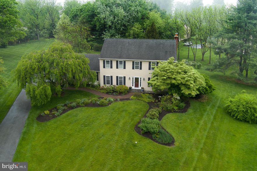Welcome to 1783 Suffolk Downs—a meticulously maintained and tastefully appointed residence situated on a premium, private one-acre cul-de-sac lot within the highly desirable community of Hunt Country in East Goshen. This exceptional home blends classic design with thoughtful updates beginning with a notable first floor expansion which transformed the heart of the home, featuring a redesigned and enlarged Gourmet Kitchen, Breakfast Room, walk-in Pantry, Laundry Room, Mudroom, and Powder Room. The chef-inspired Kitchen boasts custom soft white cabinetry, granite countertops, a timeless subway tile backsplash, and a suite of premium stainless appliances including a Bosch wall oven, built-in microwave, cooktop, and French-door refrigerator. Throughout the main level, rich hardwood floors and custom millwork lend warmth and sophistication. The peaceful Living Room offers custom built-in illuminated cabinetry, and the formal Dining Room features stylish French doors and wainscoting. The sun-filled Family Room opens to the rear deck and is anchored by a raised-hearth brick fireplace framed by custom built-ins, enhancing the home's inviting ambiance. Upstairs, the Primary Bedroom features a customized walk-in closet with designer shelving and updated Primary Bath complete with a large, tiled shower with bench seat, linen closet, and ceramic flooring. Three additional generously sized Bedrooms share a well-appointed Hall Bath featuring a double-sink vanity, tiled tub/shower, and an expansive double linen/storage closet. The finished Lower Level offers additional flexible living space ideal for a Media Room, Recreation Area, or Home Gym. The Outdoor Living is equally impressive with a maintenance-free Trex deck and charming flagstone patio that overlook a tranquil, tree-lined backyard, perfect for quiet evenings or entertaining guests. Additional highlights include a new HVAC system (2022) and a two-car garage. This exceptional property is located within the award-winning West Chester School District and just minutes from top-tier private schools, the Malvern and Paoli train stations, and the vibrant dining and shopping scenes of downtown West Chester, Malvern, and the Main Line. Residents also enjoy easy access to East Goshen Park, Applebrook Golf Club, and a variety of scenic walking trails. Don’t miss the opportunity to own this beautiful home in one of East Goshen’s most sought-after communities.
