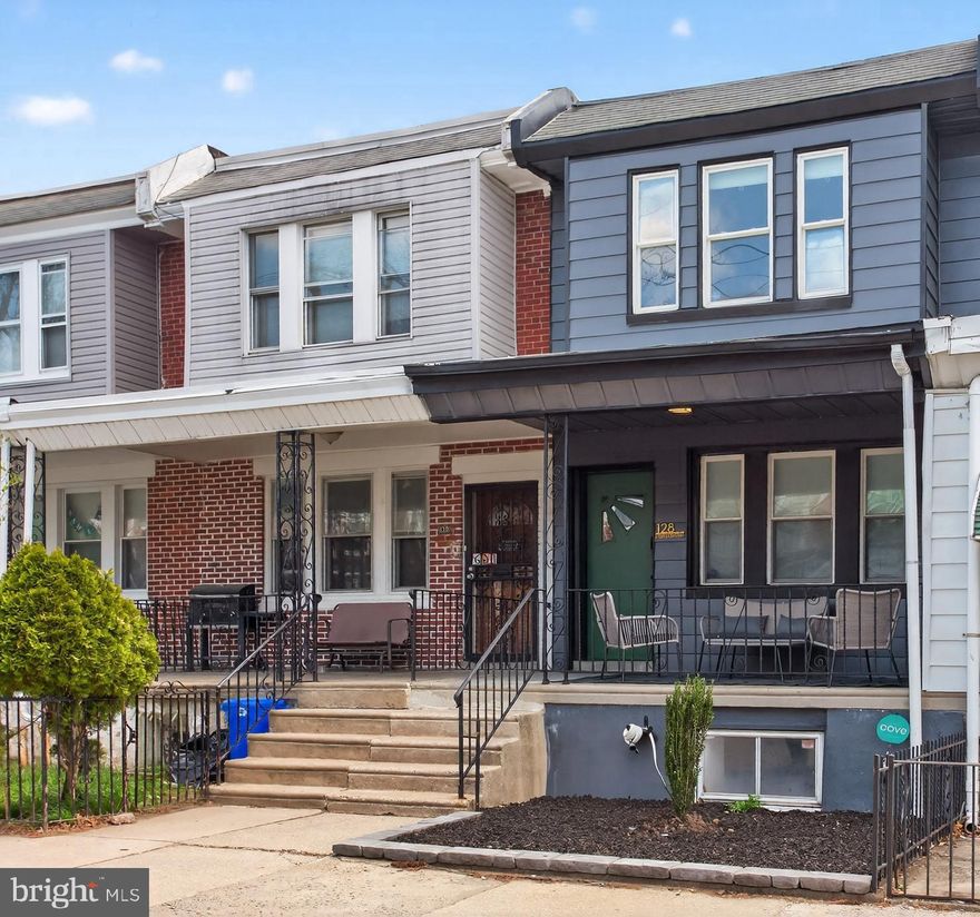 Welcome to 128 E Tulpehocken Street! This beautifully renovated 3-bedroom / 2.5 bathroom  East Germantown row home blends modern upgrades with thoughtful design throughout. Step up to the inviting front porch and into the open-concept main level, where hardwood floors and recessed lighting create a warm, contemporary feel. The spacious living area flows seamlessly into the dining space, perfect for entertaining or relaxing at home, and is complemented by a stylish powder room. A convenient under-stair closet offers flexible storage as a pantry or coat closet. The kitchen is a true highlight, featuring porcelain tile floors, stainless steel appliances, quartz countertops with ample workspace, shaker-style cabinets and a tasteful ceramic tile backsplash. Just off the kitchen, a private balcony provides the perfect spot for your morning coffee or a quiet evening unwind. Upstairs, you’ll find 3 bedrooms. The rear bedroom offers generous space and ample closet storage, while the middle bedroom is ideal for guests, a nursery, or a home office. The full hall bathroom showcases a modern vanity, porcelain tile flooring, a subway-tiled tub/shower combo, and a classic Philadelphia skylight that fills the space with natural light. The primary suite, located at the front of the home, features a bright, spacious layout and an ensuite bathroom with a subway-tiled stall shower, tiled floors, and a sleek vanity. The fully finished walkout basement is perfect for a media room, gym, or office and provides direct access to the rear patio and one-car garage. Additional highlights include hardwood flooring throughout, recessed lighting, stainless steel appliances, and a new 4-zone mini-split system for efficient, customizable comfort.  Schedule your showing today!!