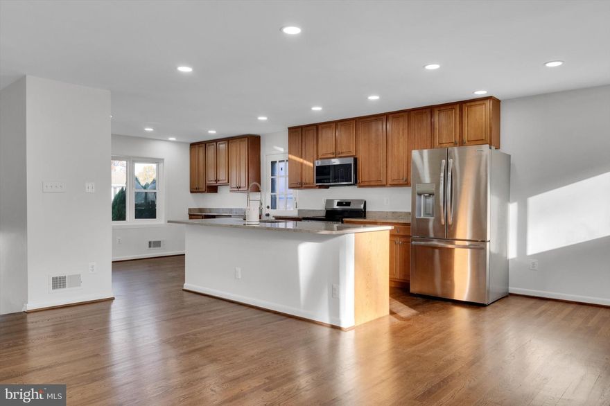 Beautifully renovated and thoughtfully designed, this 4-bedroom, 3-bathroom home is truly a must-see. Step inside to an open and airy layout featuring gleaming hardwood floors, a cozy wood-burning fireplace, and an updated eat-in kitchen that anchors the main level. The kitchen is equipped with brand-new stainless-steel appliances, new granite countertops, generous cabinet space, built-ins, and a functional center island—ideal for everyday living and entertaining. The fully finished basement offers an additional spacious family room, perfect for movie nights, a home office, or extra lounging space. The primary bedroom includes its own ensuite bathroom along with two closets for added convenience.  Additional features include dedicated laundry space and a shed. Both the front and backyard are expansive, providing plenty of outdoor space along with a storage shed. The private driveway comfortably fits 2–3 cars. Nestled in a prime location near major commuter routes—I-495, 295, 50, Metro access (orange line and MARC), shops, and restaurants—this home offers comfort, convenience, and modern upgrades throughout.