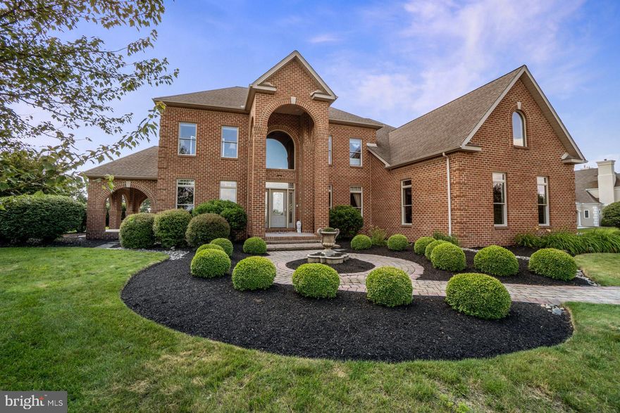 Located in the exclusive community of The Manor and within the prestigious Northwestern Lehigh School District, this stately brick colonial offers over 4,700 square feet of living space with four bedrooms, two full & two half baths. It blends timeless design with custom modern style. From the moment you step into the soaring two-story foyer, you’re greeted by elegant lighting & intricate iron railings. The dramatic family room features a custom fireplace set against a striking floor-to-ceiling wood-accent wall, & oversized windows that fill the space with natural light. The open-concept kitchen features custom cabinetry, granite counters, and sub-zero refrigerator. Formal living & dining spaces feature bold accent walls, while a main-level office with porch access offers a quiet retreat, perfect for those working from home. Upstairs, the expansive primary suite includes a gas fireplace, a spa-like bath with dual vanities, a jetted tub, a picture window with a breathtaking view, and a spacious walk-in closet. Three additional bedrooms include walk-in closets and a split-entry bath. Adjustable radiant heated flooring adds comfort throughout the home. The finished lower level offers a theater, wet bar, game area, guest room & half bath. Built-in surround sound enhances the experience inside and out. Step outside to 2.6 acres of beautifully landscaped grounds with a paver patio, fire pit & screened gazebo. Minutes from everything, yet tucked away in a quiet upscale neighborhood.