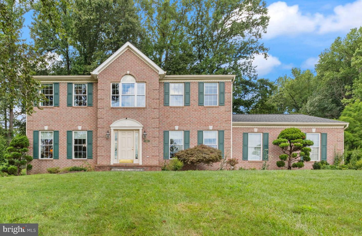 Welcome to this beautifully maintained single family home tucked away on a prime corner lot in the sought-after Woodcrest community of Fallston. Ideally located near the end of the development, this home offers a peaceful setting, a flat backyard lined with mature trees, and a two-car side-entry garage with space for 2 cars and extra space for your lawn equipment or tools! A charming paver walkway and bluestone steps (2018) lead you to the front porch and into a warm and inviting foyer with refinished hardwood floors (2025). On either side of the entry, you’ll find spacious formal living and dining rooms, both with hardwood flooring and elegant crown molding. The dining room also features chair rail trim, and the living room has updated lighting (2025). These rooms are perfect for hosting gatherings and special occasions. The inviting family room is filled with natural light and centers around a beautiful fireplace, creating the perfect spot to relax. Nine-foot ceilings on the main level enhance the openness, especially in the kitchen and family room areas. The updated eat-in kitchen (2023) features 42” oak cabinets, new quartz countertops, custom backsplash, a center island, additional cabinetry added for pantry storage and hardwood floors. The stainless-steel appliances complete this cook’s dream kitchen. Off the eat-in kitchen, an upgraded sliding glass door with built-in blinds leads to a maintenance-free composite deck—ideal for entertaining and overlooking the level backyard. A half bath is conveniently located off the kitchen, and the main-level laundry room includes built-in cabinetry. The oversized two-car garage offers ample space for vehicles plus your snowblower, tractor, or extra equipment! Upstairs, you’ll find four spacious bedrooms, including a lovely primary suite with a walk-in closet and a fully renovated en-suite bath (2018) featuring heated floors, a custom-tiled shower, and frameless glass doors. The updated hall bath is equally impressive with stylish custom tilework in the tub/shower and flooring with large linen closet. The three additional bedrooms on the upper level are generously sized, each with ample closet space. The unfinished lower level is a blank canvas, ready for your vision. Whether you dream of a second family room, recreation room, gym, office, or hobby space, the possibilities are endless. Don’t miss the incredible outdoor space! Walk down the stairs of the composite deck to the spacious firepit area, complete with stone steps leading up to it, perfect for gatherings under the stars. Walk around the yard and find landscaped garden beds, designed by a master gardener, the gardens provide beautiful pops of color throughout the year. Lovingly cared for by the original owners, this home boasts other recent updates including, well conditioner head (2024), well pump (2023), well tank (2023), architectural roof (2013) and freshly painted interior in a neutral palette (2024). This home truly has it all, space, updates, location, and charm. Schedule your private showing today and prepare to fall in love with your new home!
Professional Pictures coming soon!