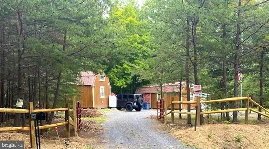 2 CABINS / MOUNTAIN STREAM / 2.5+ ACRES / NO HOA / LIVE OFF GRID!!  This property features 2 cabins, each with its own generator, tankless water heater, and mini-split heat/air!  Overlooking your own bold mountain stream and mature hardwood forest!  Excellent paved road access and READY TO ENJOY!!  DON'T MISS THIS UNIQUE PROPERTY... SCHEDULE YOUR APPOINTMENT TODAY!!