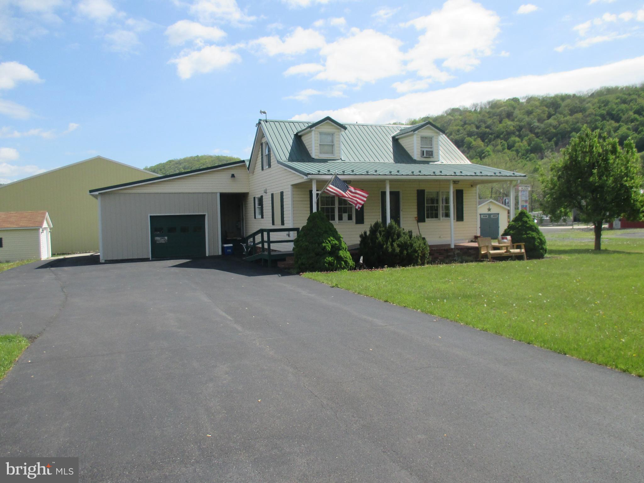 PRIME COMMERCIAL BUILDING IN HIGH TRAFFIC COMMERCIAL ZONE. CORNER LOT ADJACENT TO POTOMAC PLAZA AND WVU MEDICINE. STEPS AWAY FROM WAL MART AND STATE RTE 220. LARGE ATTACHED GARAGE, STORAGE SHED, AND 12X15 DETACHED GARAGE. MULTIPLE COMMERCIAL OPPURTUNITIES (OFFICE, RETAIL, MIXED USE). BUILDING WAS COMPLETELY REMODELED AND UPDATED WITH VINYL SIDING AND METAL ROOF. FABULOUS LOCATION WITH HIGH TRAFFIC COUNT AND GOOD VISIBILITY. DON'T WAIT, CALL TIM! SQUARE FOOTAGE IS ESTIMATED.
