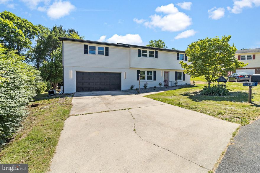 This home is practically new completely remodeled inside and out with new everything and ready for you to move right in. With a brand new roof and siding, new kitchen and baths, new paint and flooring, new appliances, fixtures, faucets, hvac....too much to list. The home is larger then it appears with over 3000 square feet. 6 bedrooms 3 bathrooms with multiple main level living areas and dining spaces. Huge living room with fireplace. Well designed two tone kitchen looks straight out of a showroom. All in a convenient location with no HOA.