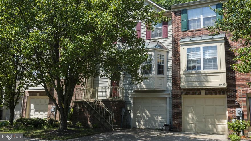 Townhouse backs to woods, has hardwood throughout entryway, kitchen, dining room and stairway to basement.  Kitchen has black appliances and granite with breakfast bar. All baths have been updated.  Deck off living room. Walk out  finished lower level with family room, 1/2 bath and garage. Needs a little TLC