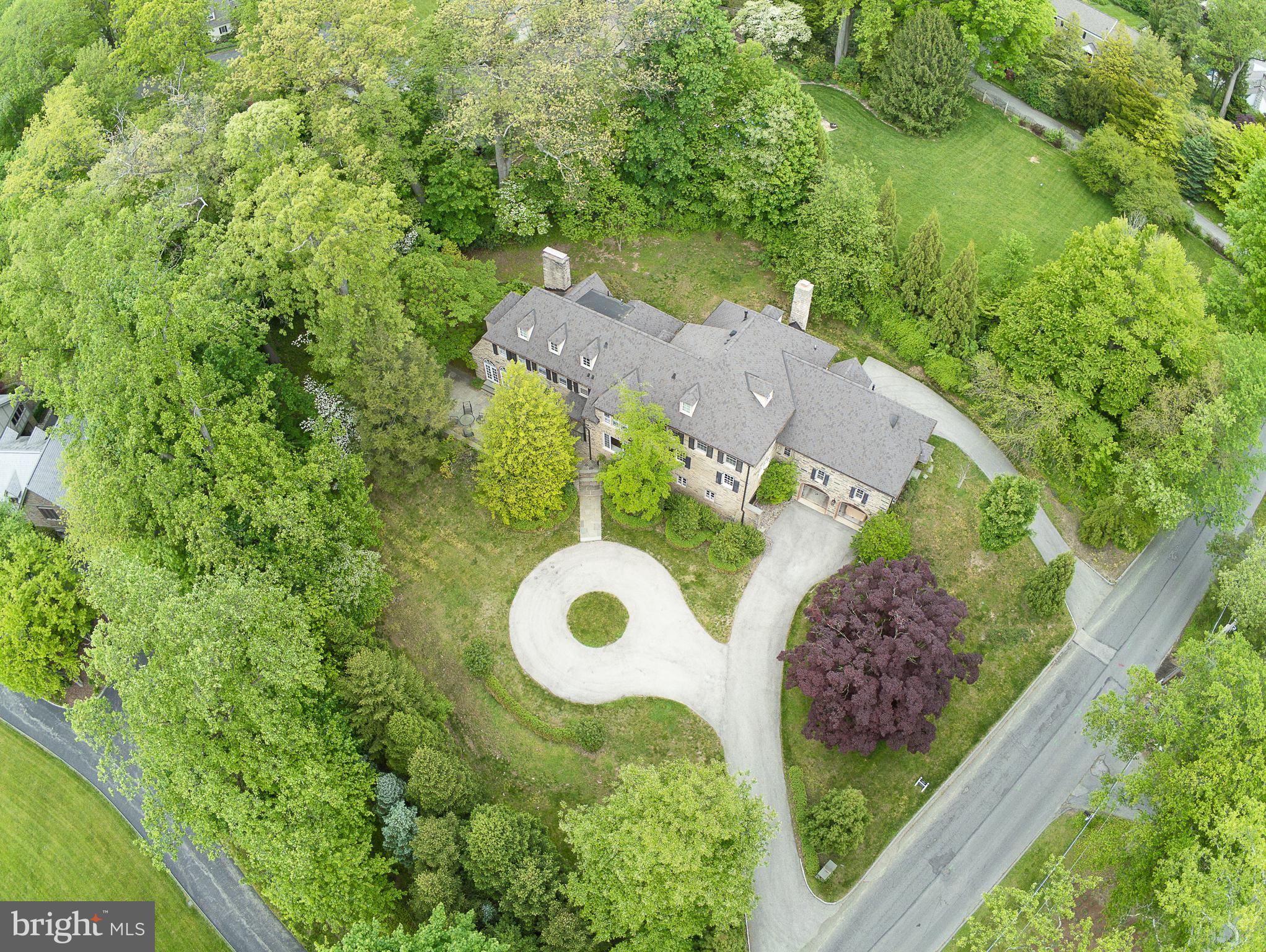 Situated in prestigious Northside Haverford, this elegant home must be seen to be fully appreciated. Photos do not fully capture the essence of this fine property. "Copewood" is a splendid three-story, all-stone Normandy (c. 1930) extensively renovated and significant expanded in 2009. The home harmoniously blends rich and timeless architectural details with an up-to-date floor plan and amenities to create spaces sure to please today's most discerning buyer. Seeing is believing so schedule an appointment today! While the Kitchen-Family Room area is the first-floor hallmark that will most pleasantly surprise you for a house of this age, the incredible Master Suite on the second floor will astonish you. It includes a large Master Bedroom with gas fireplace, an elegant Study/Office, two Dressing Rooms with their adjacent bathrooms plus a bonus area adjacent to one of the baths that can be used as additional closet space.