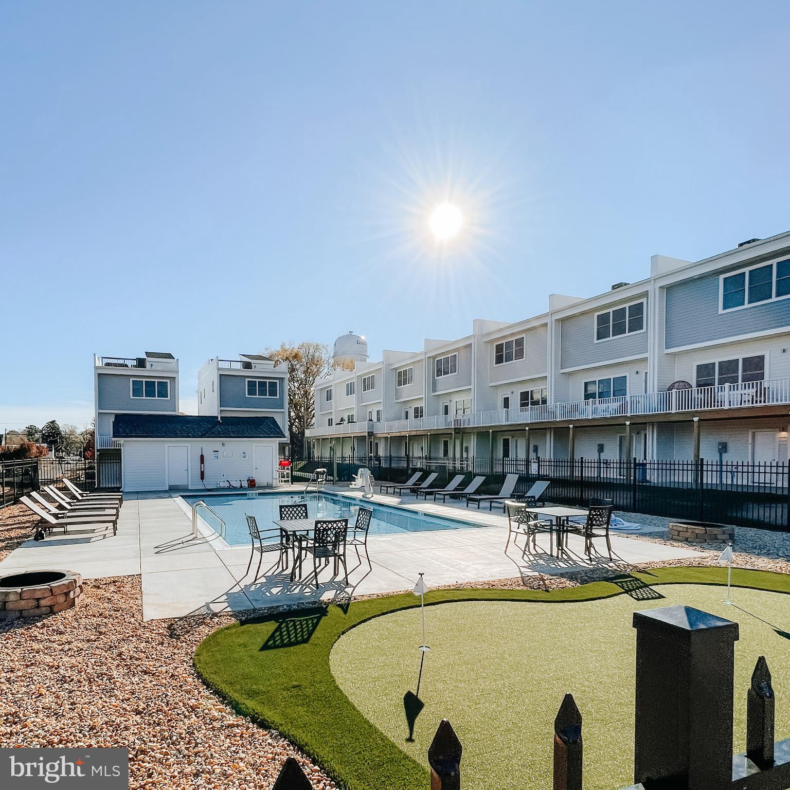 Absolutely gorgeous furnished townhome with spectacular water views. If you're looking for pure luxury with a community pool this is the home for you. Available to rent up to 24 months. Located in the center of town where you can walk, bike or take your golf cart to restaurants, shops, breweries, town pier and the beach. If you're looking for a full time home or a weekend getaway you must take a look at this home. Come on down! Put your toes in the sand!