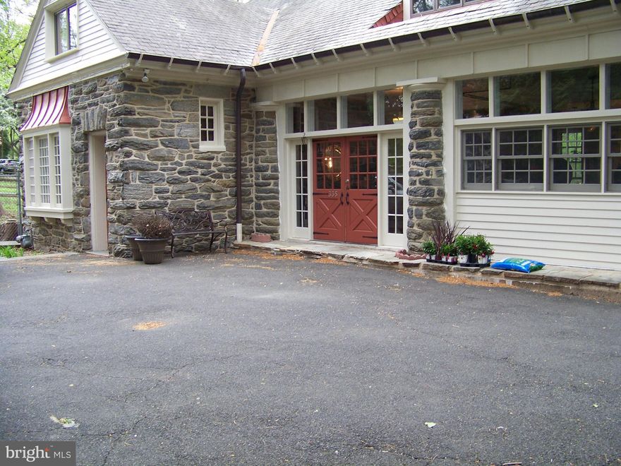 This intriguing converted carriage house with its stone structure is situated down a long shared driveway next to its neighboring estate house, circa 1908. Located on picturesque prestigious Bent Road in historic Wyncote, this home features high ceilings and large windows for lots of light and warmth. Opening the front door the home presents a wide-open space warm and a functioning wood-burning stove. The Living and dining area have an open concept for individuals who love to entertain. The open Kitchen also flows into the dining area adding to any entertainment experience.  On the first level you'll find two bedrooms and two full baths plus a laundry and storage room. The open staircase leads to the large gathering room with wood burning fireplace, with a full bar and granite counter top. The sliding glass doors leads to a balcony overlooking the back yard. The large master bedroom and bath are on the second level as well. Exiting the back door the Large, multi-leveled deck that is perfect for outdoor entertainment or secluded musing. The property is close to Jenkintown Train Station for quick access into the City, lots of shopping and walk able to lovely Cheltenham parks.
